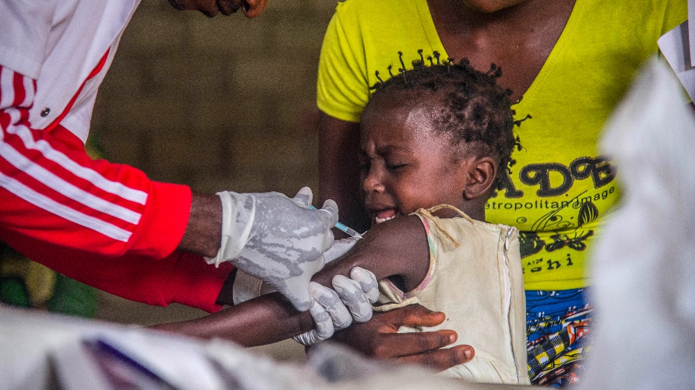 A toddler undergoes a measles vaccination at a centre in Temba, near Seke Banza, western DR Congo on March 3, 2020. Seventy-three thousand children from 6 months to 15 years old