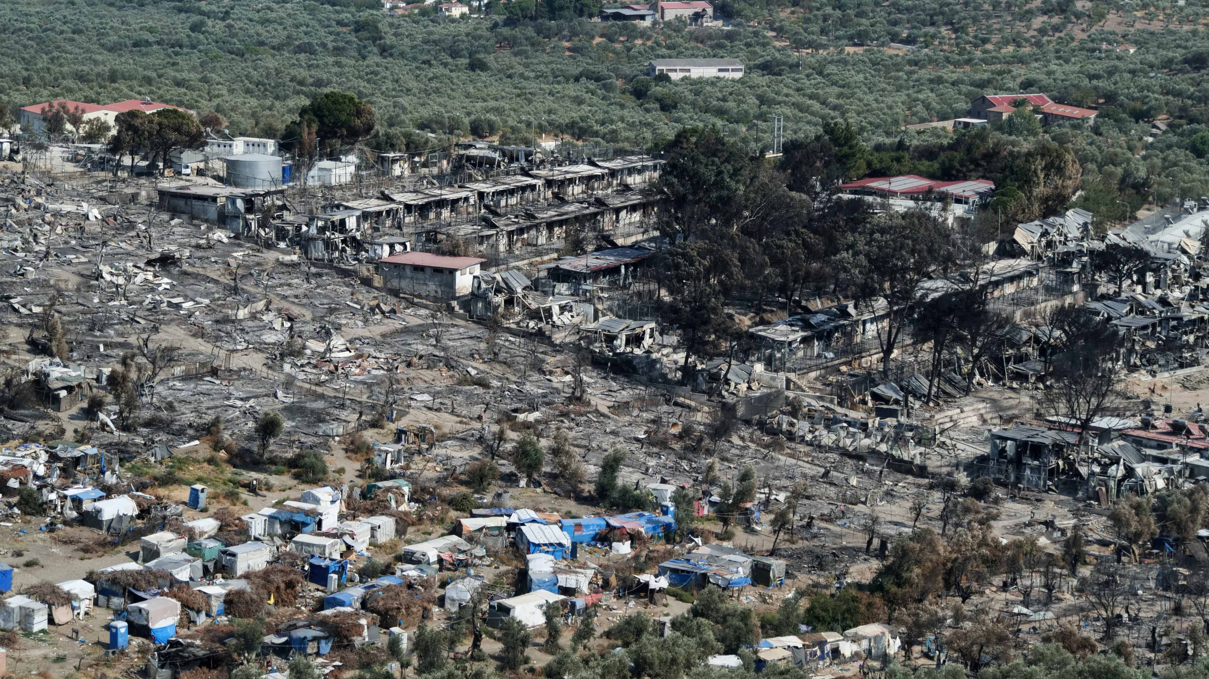 View of the destroyed Moria camp following a fire, on the island of Lesbos, Greece on September 15, 2020 [Reuters/Vassilis Triandafyllou]