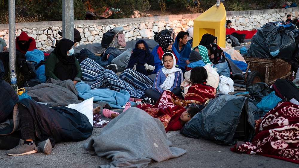 Refugees and migrants camp on a road following a fire at the Moria camp on the island of Lesbos, Greece, September 10, 2020. REUTERS/Alkis Konstantinidis