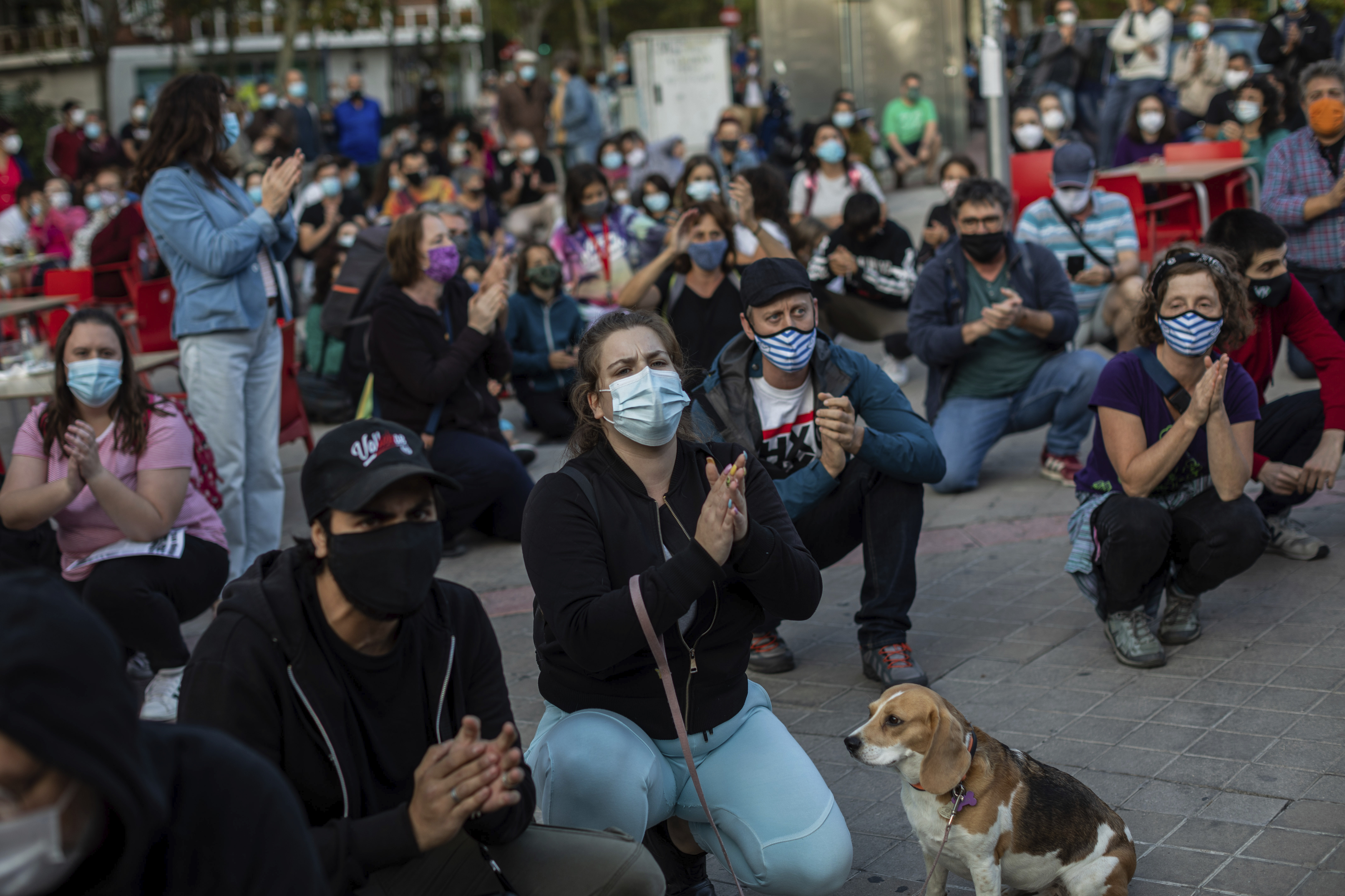 Residents of restricted mobility areas in Madrid due to the coronavirus outbreak gather during a protest to demand more resources for public health system and against social inequality in the southern neighbourhood of Vallecas, Madrid, Spain, Thursday, Sept. 24, 2020.