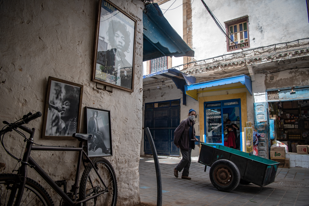 A picture taken in the Moroccan coastal city of Essaouira shows portraits of late US guitarist Jimi Hendrix on September 10, 2020. - Some claim to have seen him, others to have spoken with him -- 50 y