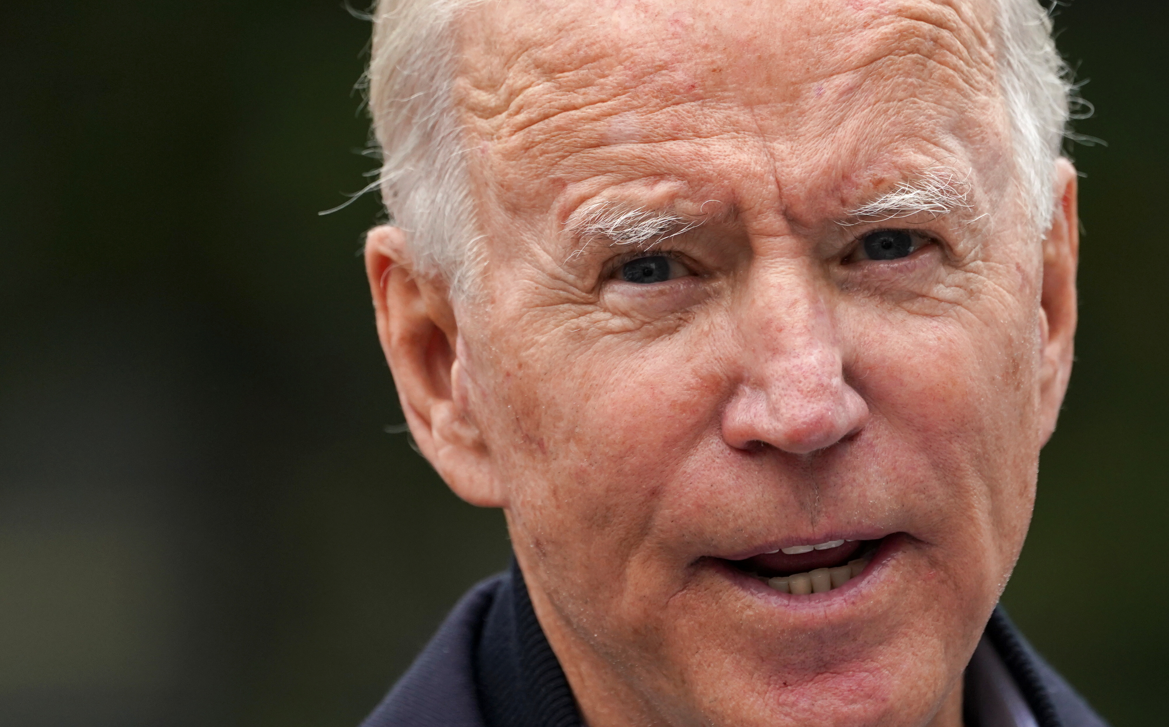 US Democratic presidential candidate Joe Biden speaks during a visit to a voter activation centre in Chester, Pennsylvania, US, October 26, 2020 [Kevin Lamarque/Reuters]