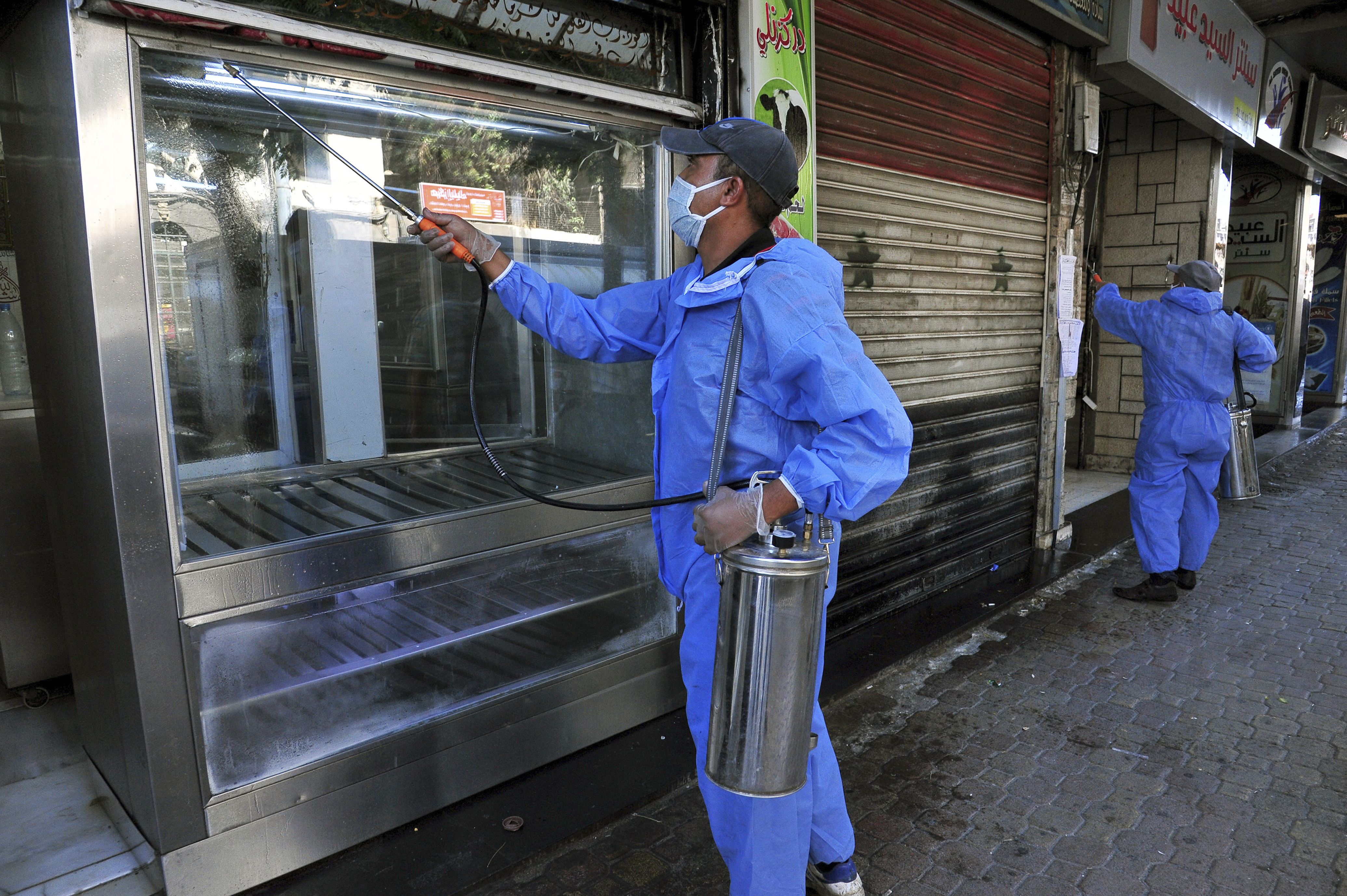 Many Syrians in government-controlled and rebel-held areas are worried they might be left out of the vaccination drive if it is carried out without any international oversight [File: AP via SANA]