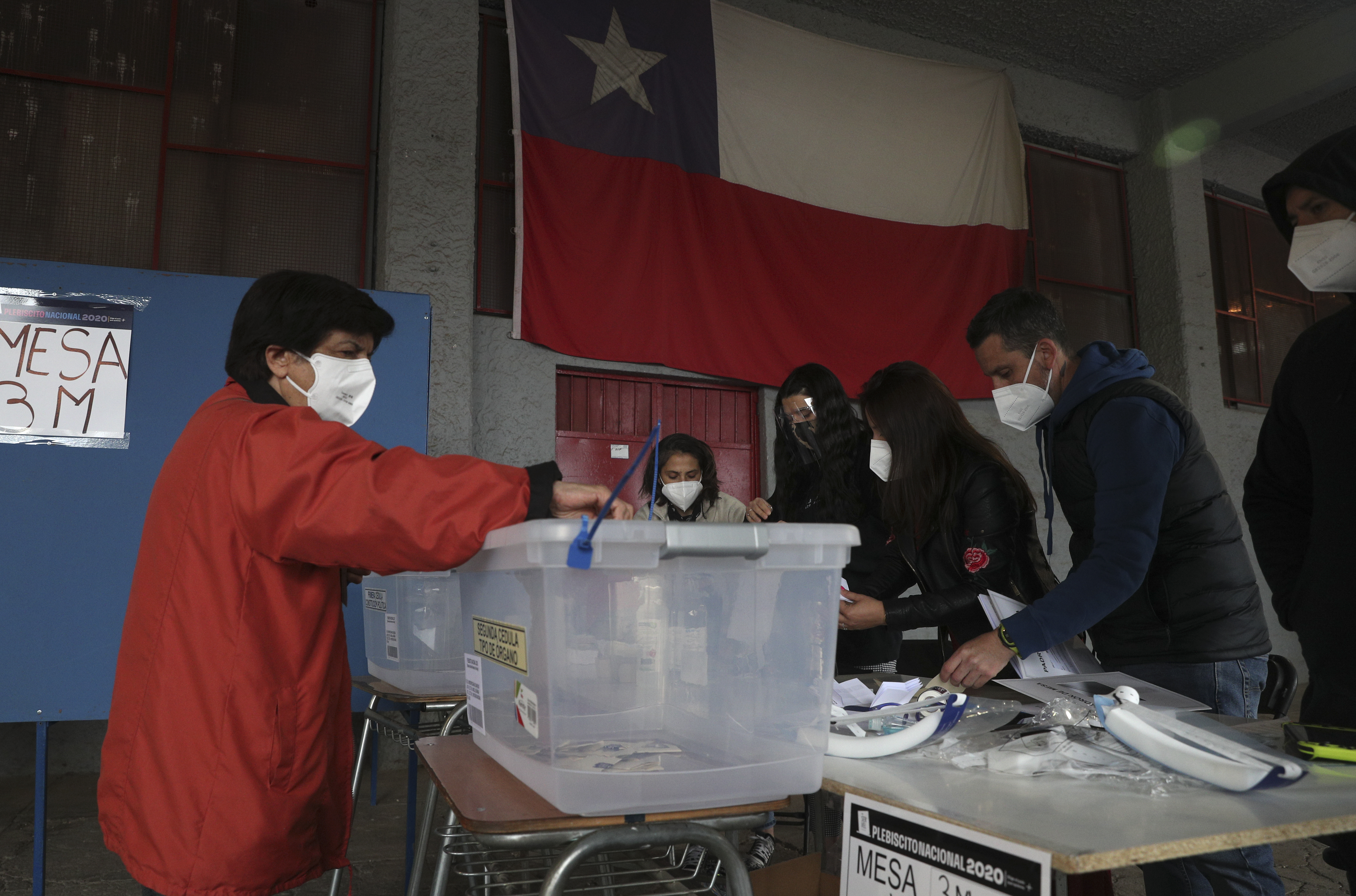 Chileans are voting on whether to draft a new constitution for their nation to replace guiding principles imposed four decades ago under a military dictatorship [Esteban Felix/AP Photo]