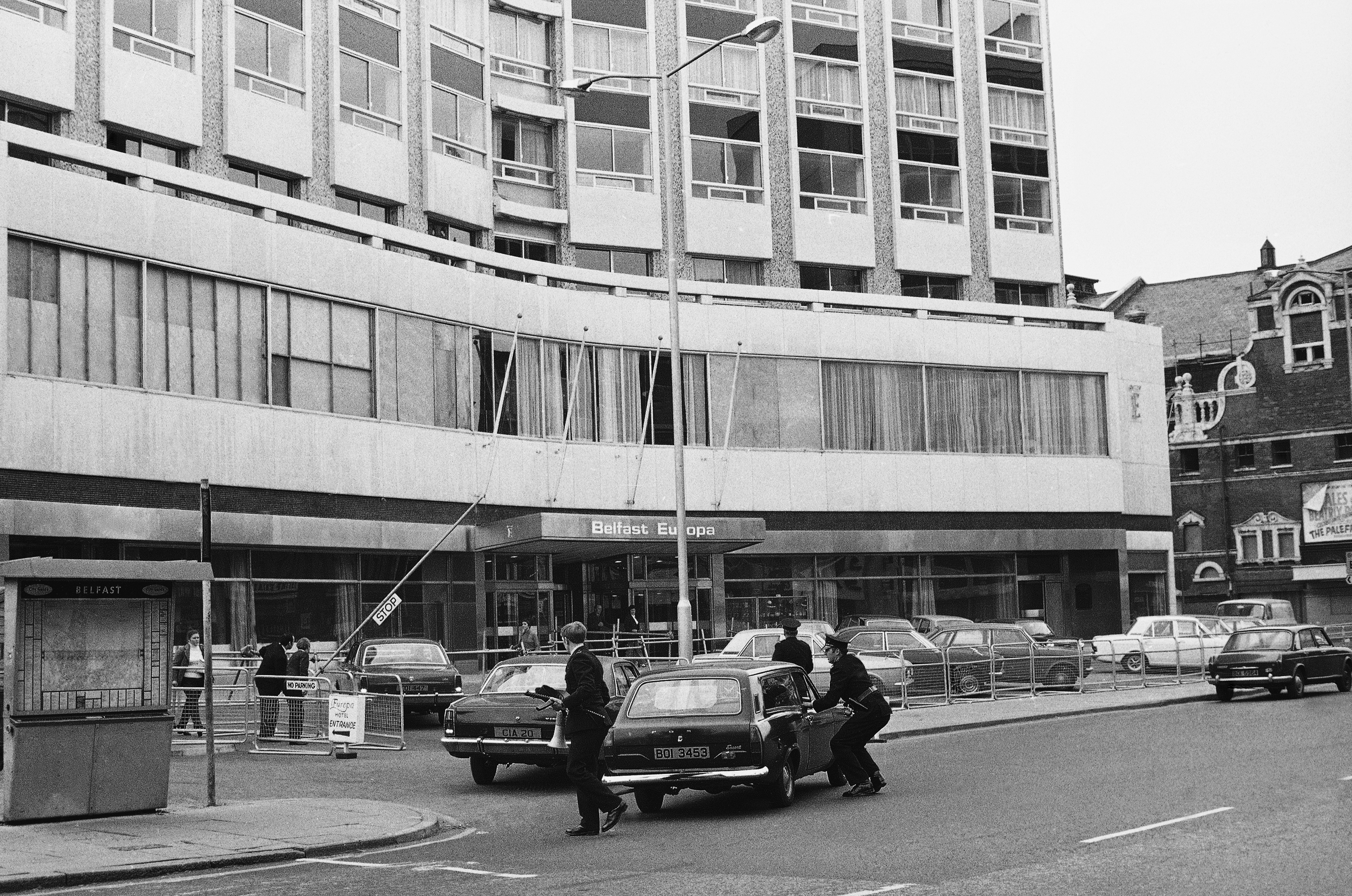 Police arrive at the barricaded Europa Hotel on September 7, 1972, to escort guests and staff to safety. By this time, the hotel had already been the scene of two previous attacks [File: Eddie Worth/AP Photo]