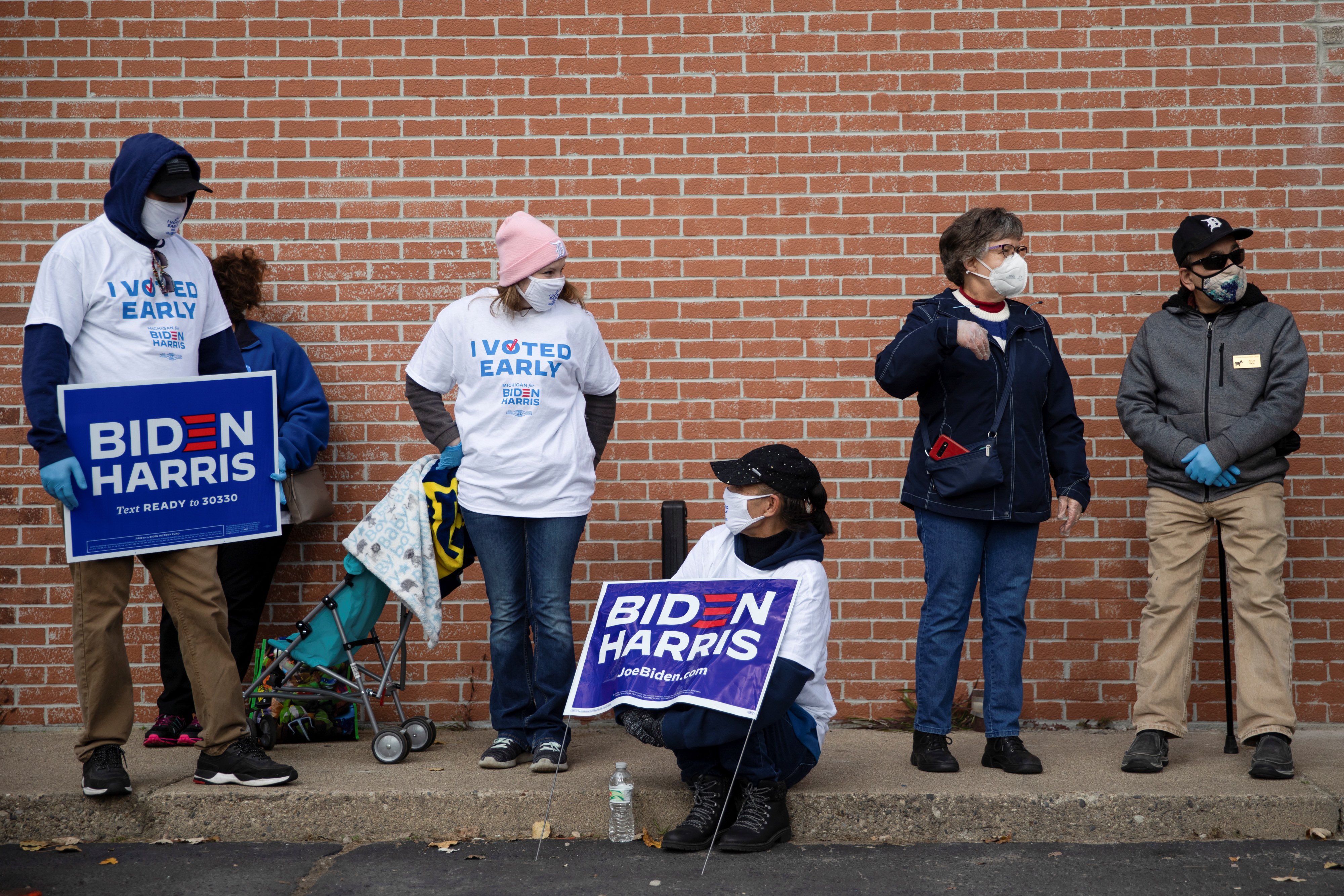 Voters wait in line for a campaign event to hear last-minute arguments from Jill Biden in Westland, Michigan, the United States