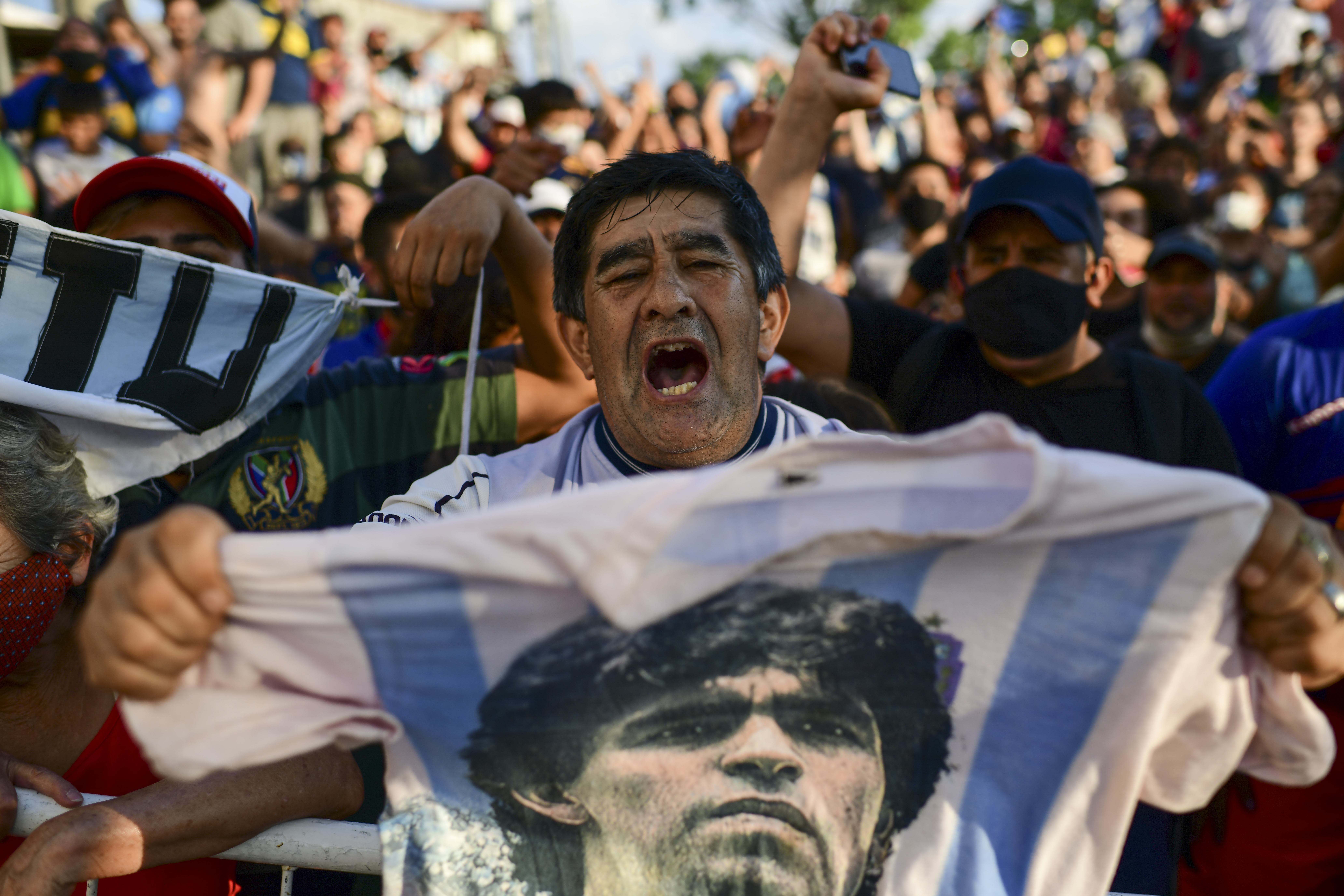 Fans gather outside the morgue where the late Argentine football star Diego Maradona's body