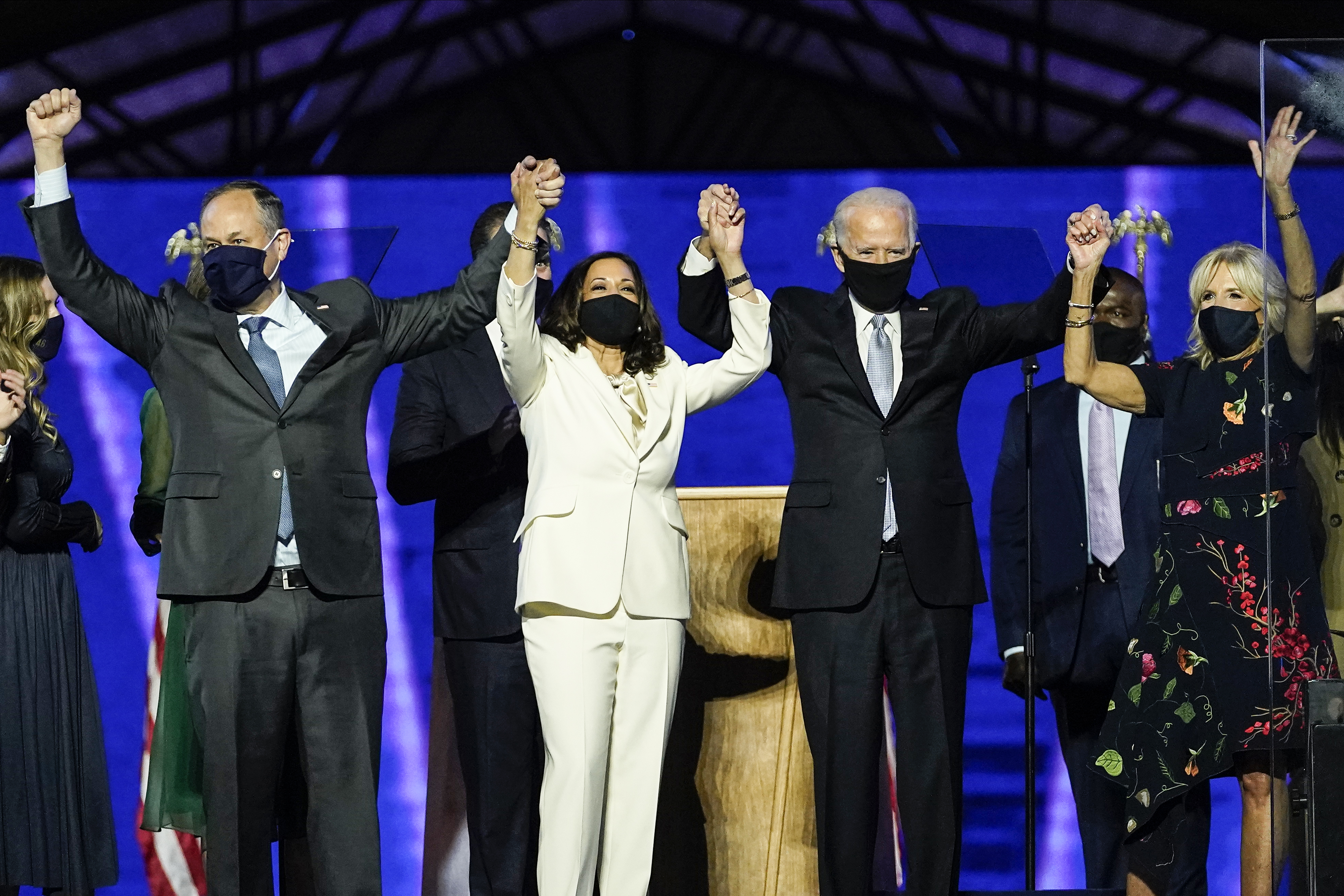 From left, Doug Emhoff, husband of Vice President-elect Kamala Harris, Harris, President-elect Joe Biden and his wife Jill Biden on stage together, Nov 7, 2020, in Wilmington, Del. [AP Photo/Andrew Harnik, Pool]