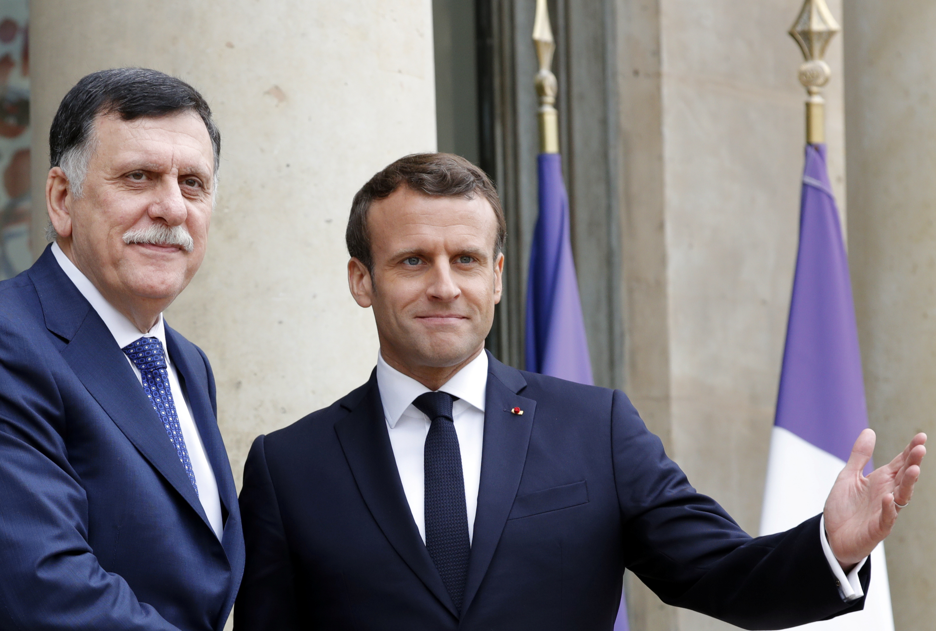 French President Emmanuel Macron meets Libyan Prime Minister Fayez al-Sarraj, who heads the UN-recognised government in Tripoli at the Elysee Palace in Paris on May 8, 2019 [File: Reuters/Philippe Wojazer]