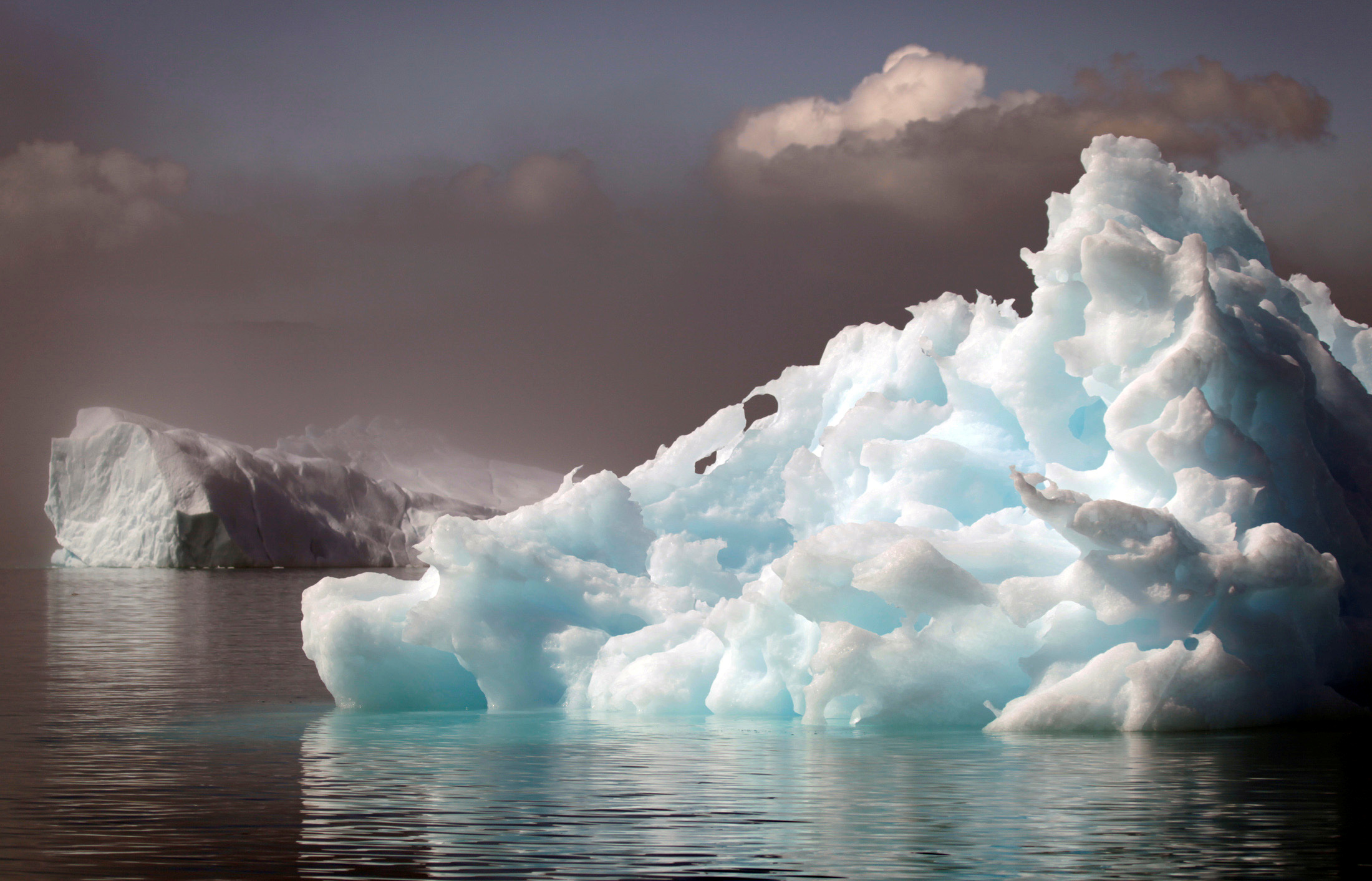 Icebergs float in a fjord near the south Greenland town of Narsaq