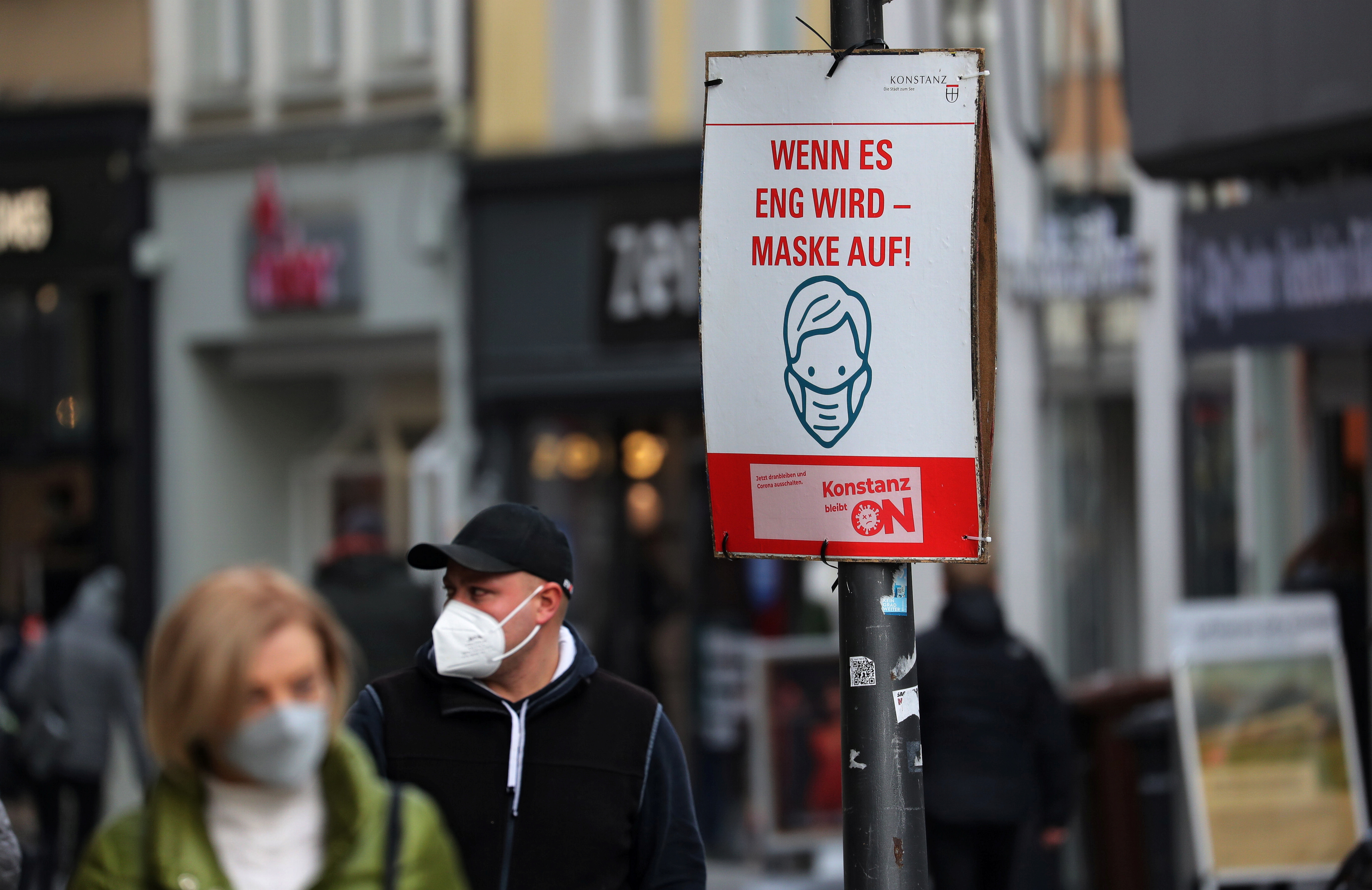 A poster demands “When it gets tight – mask on!”, as the spread of the coronavirus disease (COVID-19) continues, at a pedestrian zone in Konstanz, Germany December 15, 2020