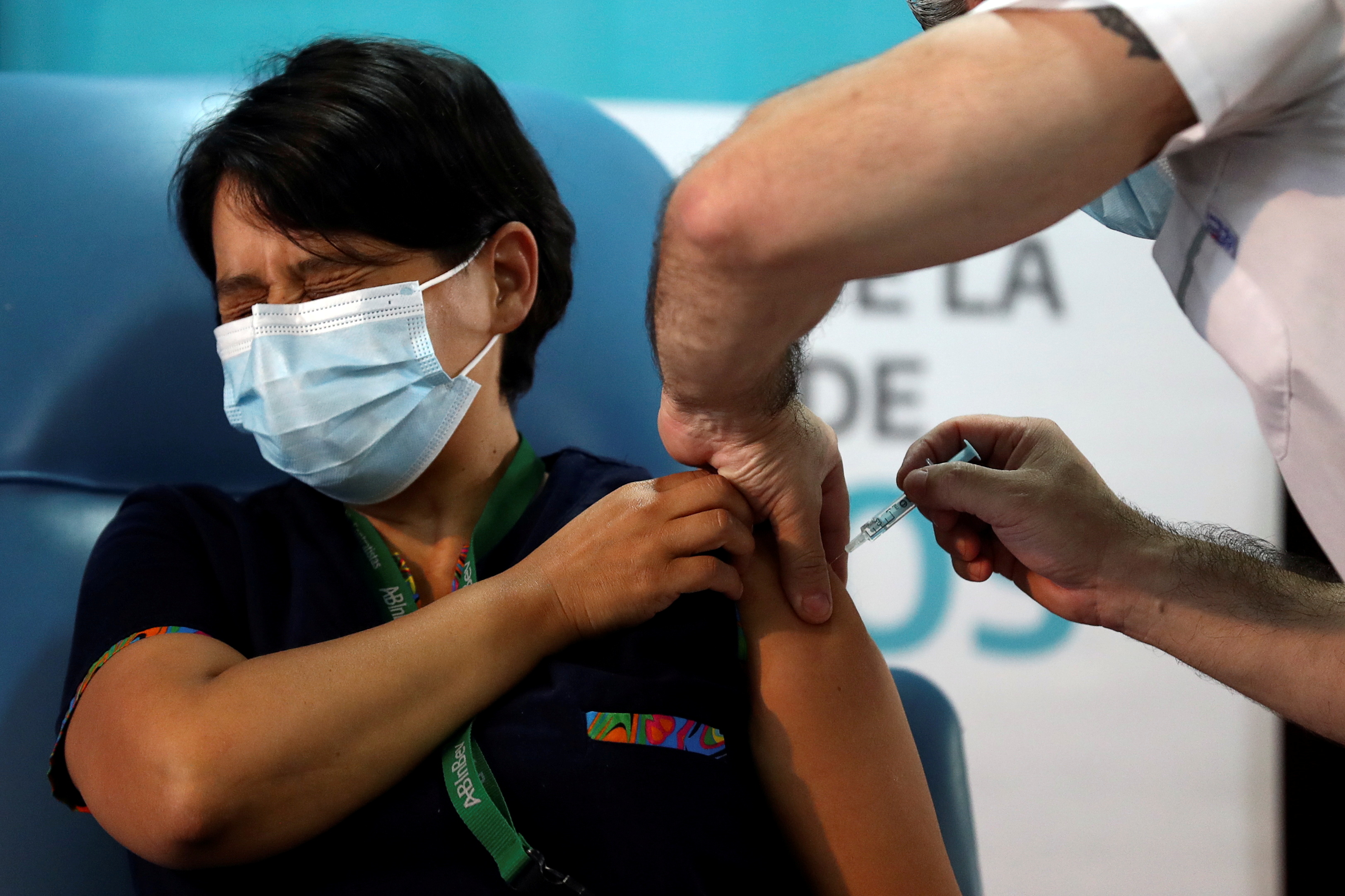 Daniela Zapata, 42, receives an injection with the Sputnik V (Gam-COVID-Vac) vaccine against the coronavirus disease (COVID-19) at Dr Pedro Fiorito hospital in Avellaneda, on the outskirts of Buenos Aires, Argentina, December 29, 2020