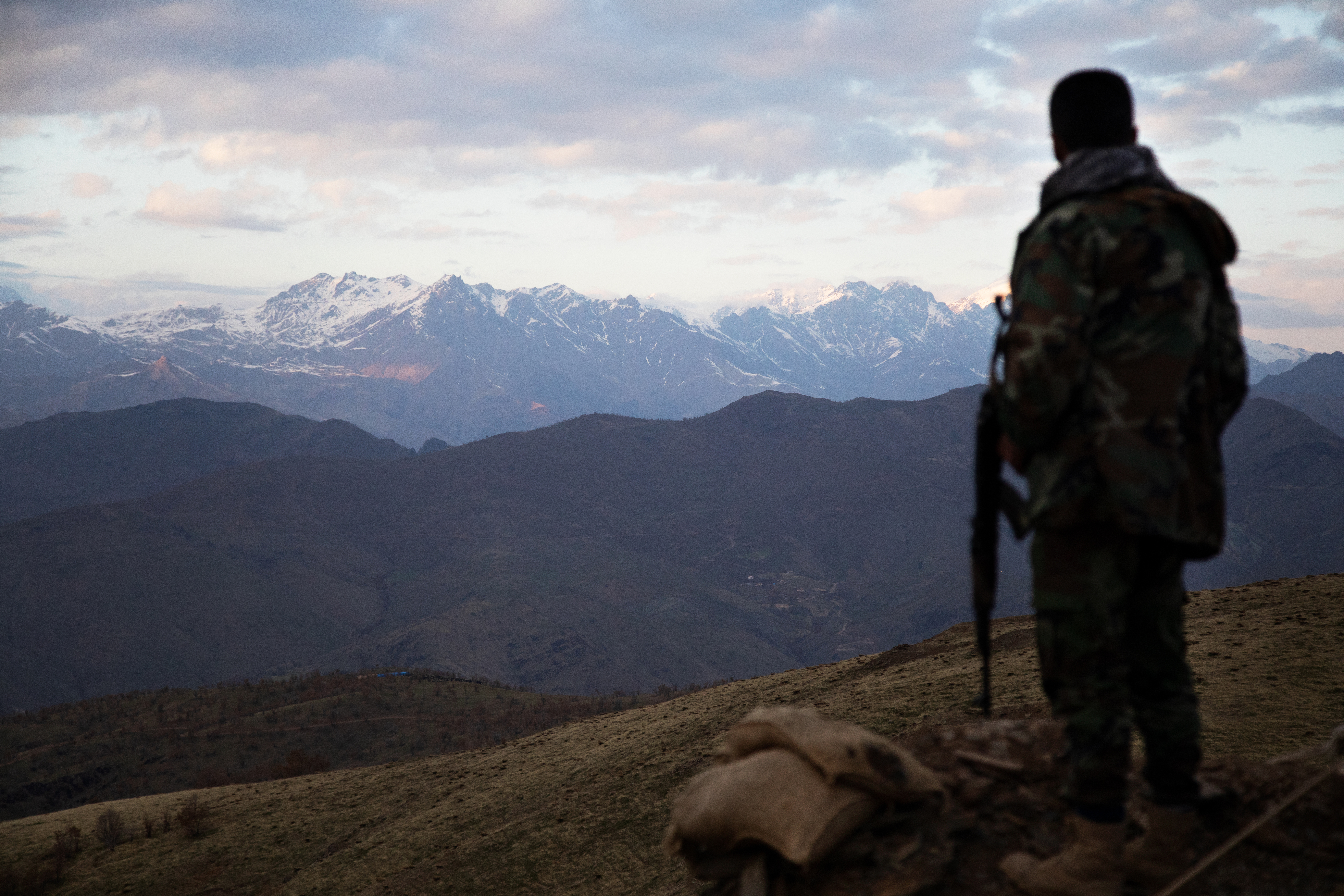 A member of the Halgurd Brigade of the Peshmerga stands guard at a newly constructed outpost close to the town of Sidekan [Adam Gnych/Al Jazeera]