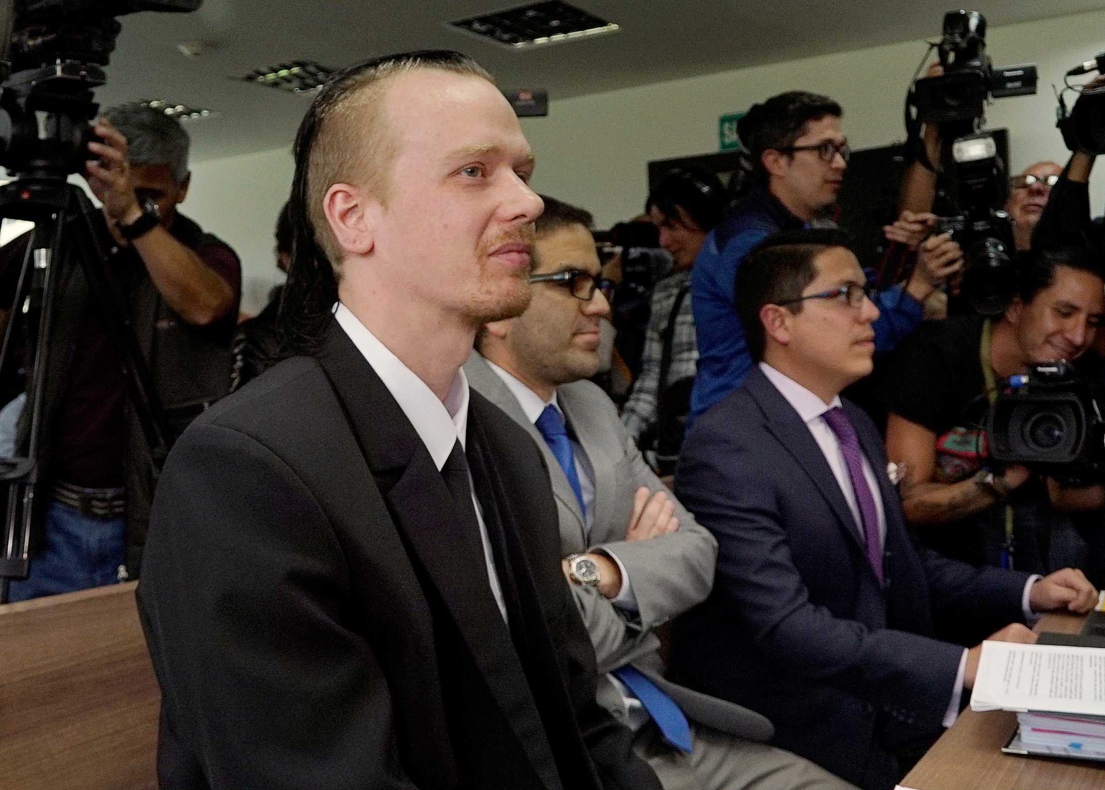 Swedish software developer Ola Bini sits in court after a local judge ordered him jailed for alleged involvement in hacking government computer systems, in Quito, Ecuador, on May 2, 2019 [Daniel Tapia/Reuters]