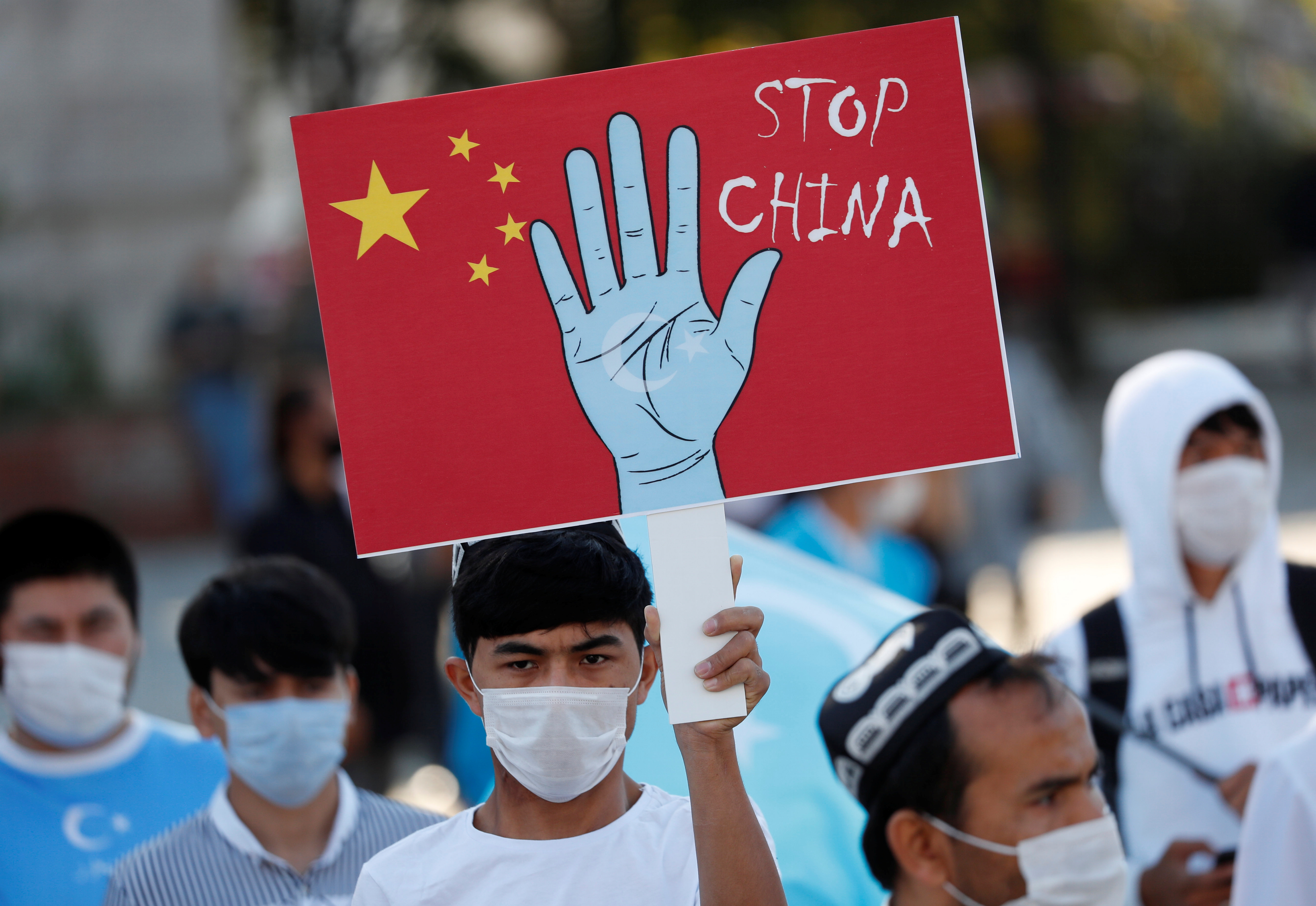 Ethnic Uighur demonstrators take part in a protest against China, in Istanbul, Turkey October 1, 2020. [Murad Sezer/Reuters]