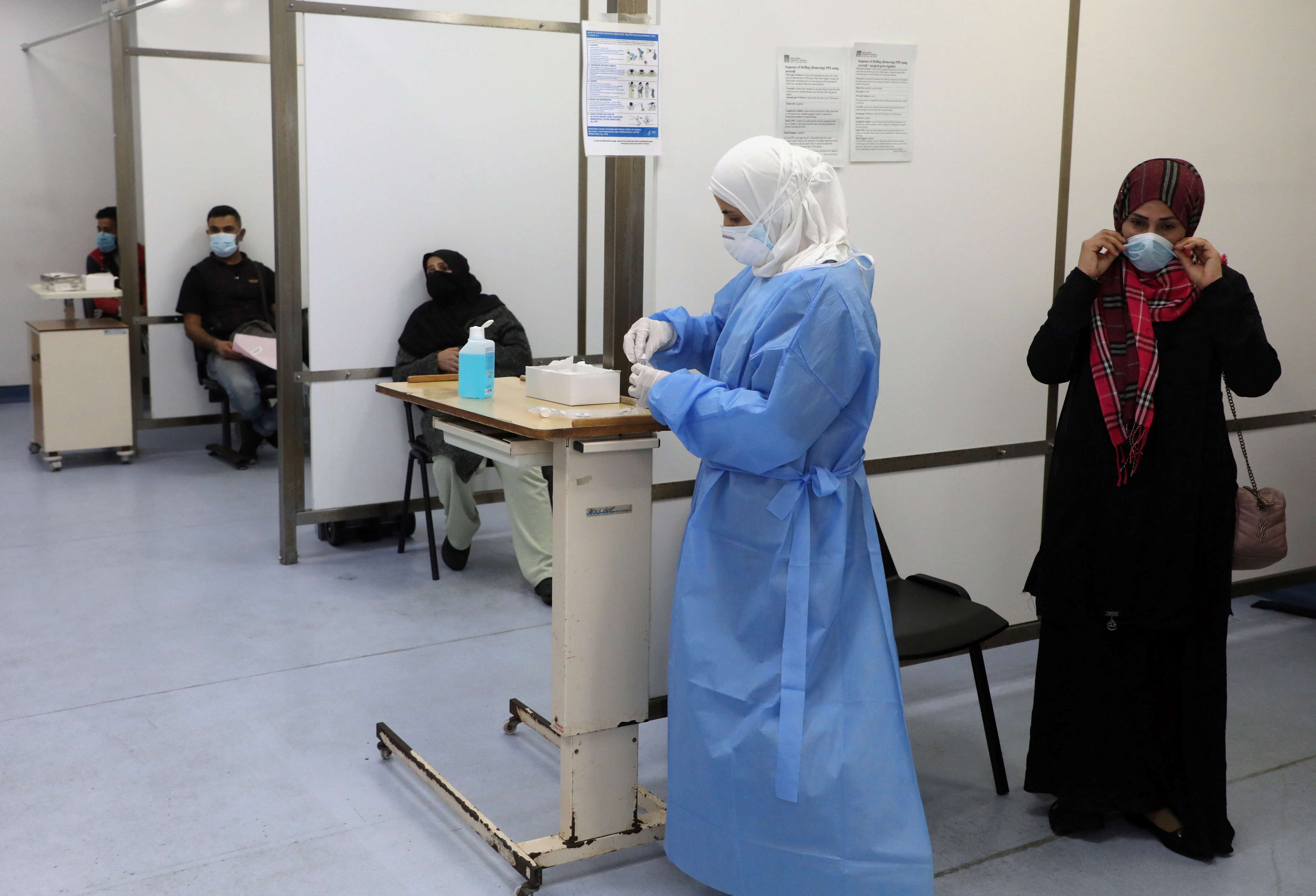 People wait to get tested for COVID-19 at Rafik Hariri University Hospital, in Beirut, Lebanon [File: Mohamed Azakir/Reuters]