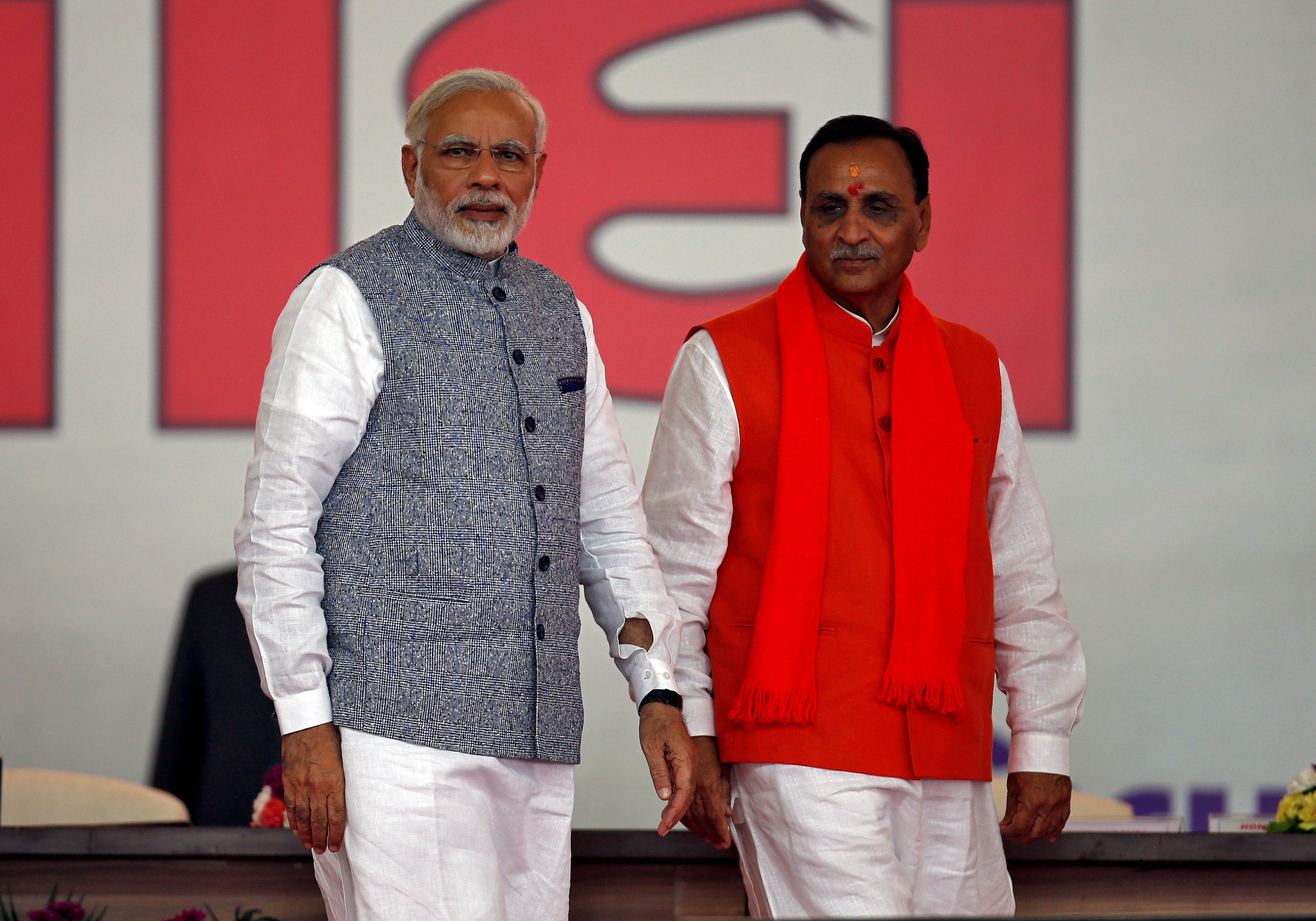 Vijay Rupani , right, with India’s Prime Minister Narendra Modi, after taking his oath as the chief minister of the western state of Gujarat in 2017
