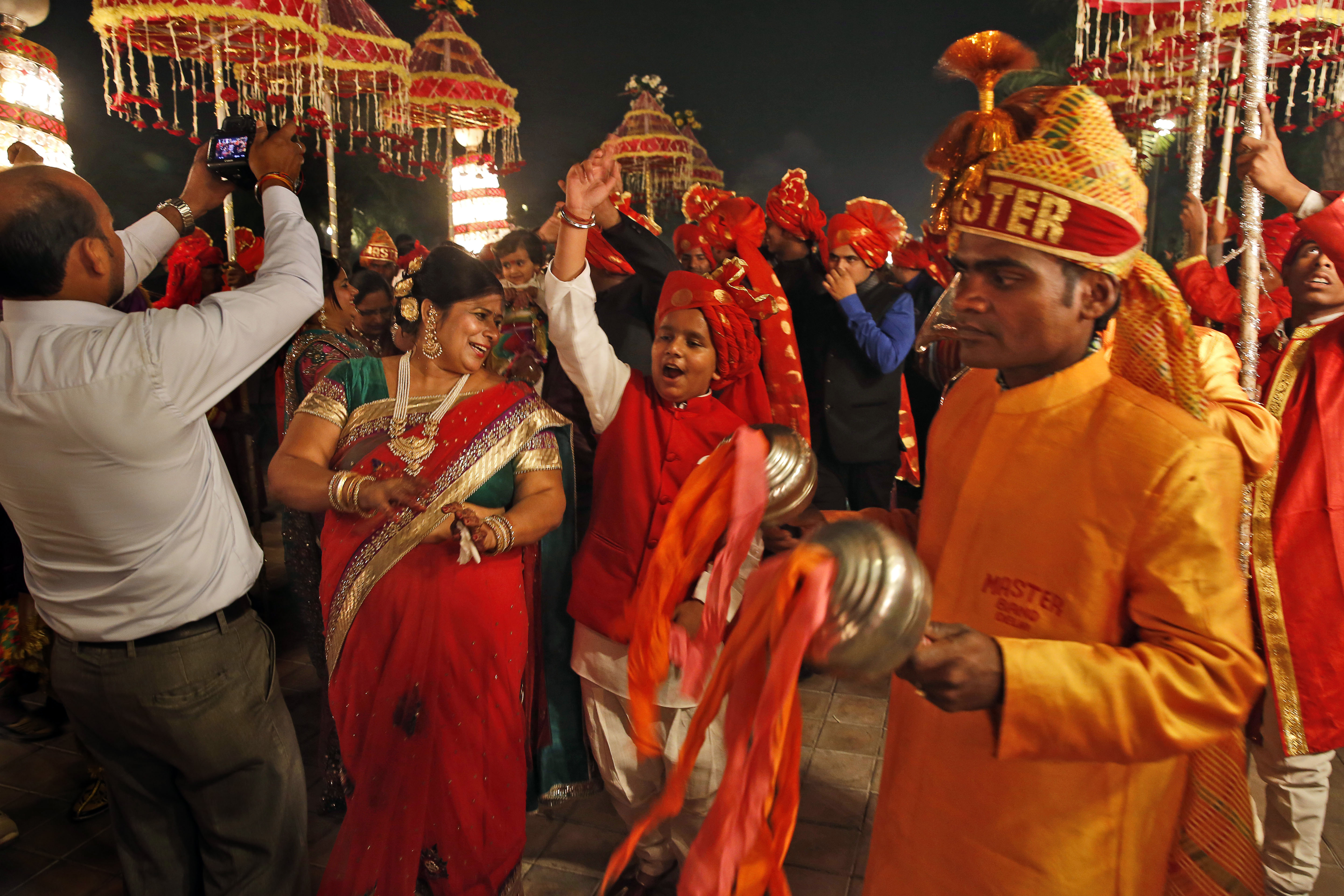 An Indian brass band plays as they accompany a wedding procession in New Delhi [File: Manish Swarup/AP]