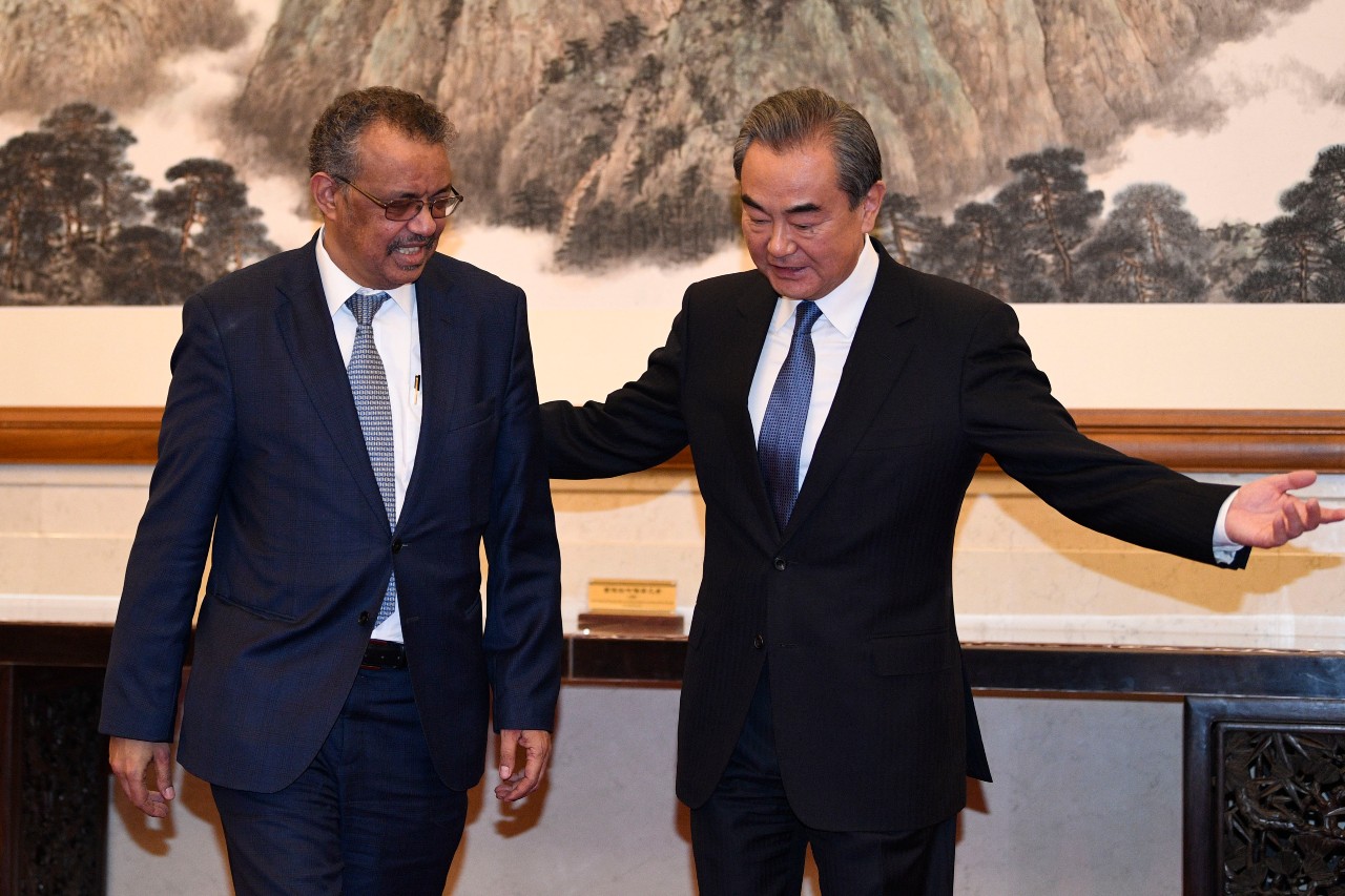 Director general of the World Health Organization Tedros Adhanom visits China epa08172125 Tedros Adhanom (L), Director General of the World Health Organization, embraces Chinese State Councilor and Foreign Minister Wang Yi (R) before their meeting at the Diaoyutai State Guesthouse in Beijing, China, 28 January 2020. EPA-EFE/NAOHIKO HATTA / POOL