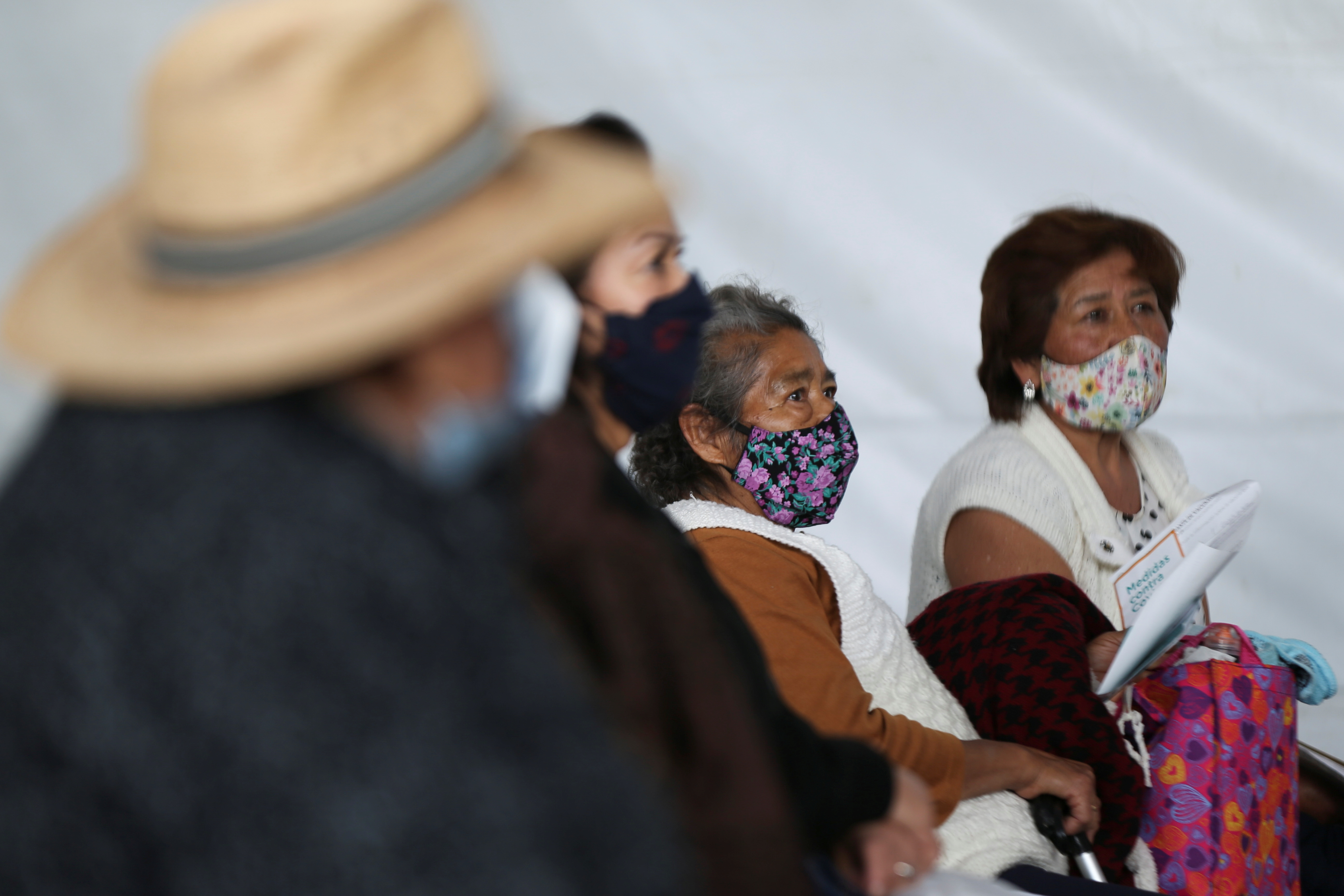 Elderly residents rest after receiving the AstraZeneca coronavirus disease (COVID-19) vaccine, at Milpa Alta municipality in Mexico City, Mexico