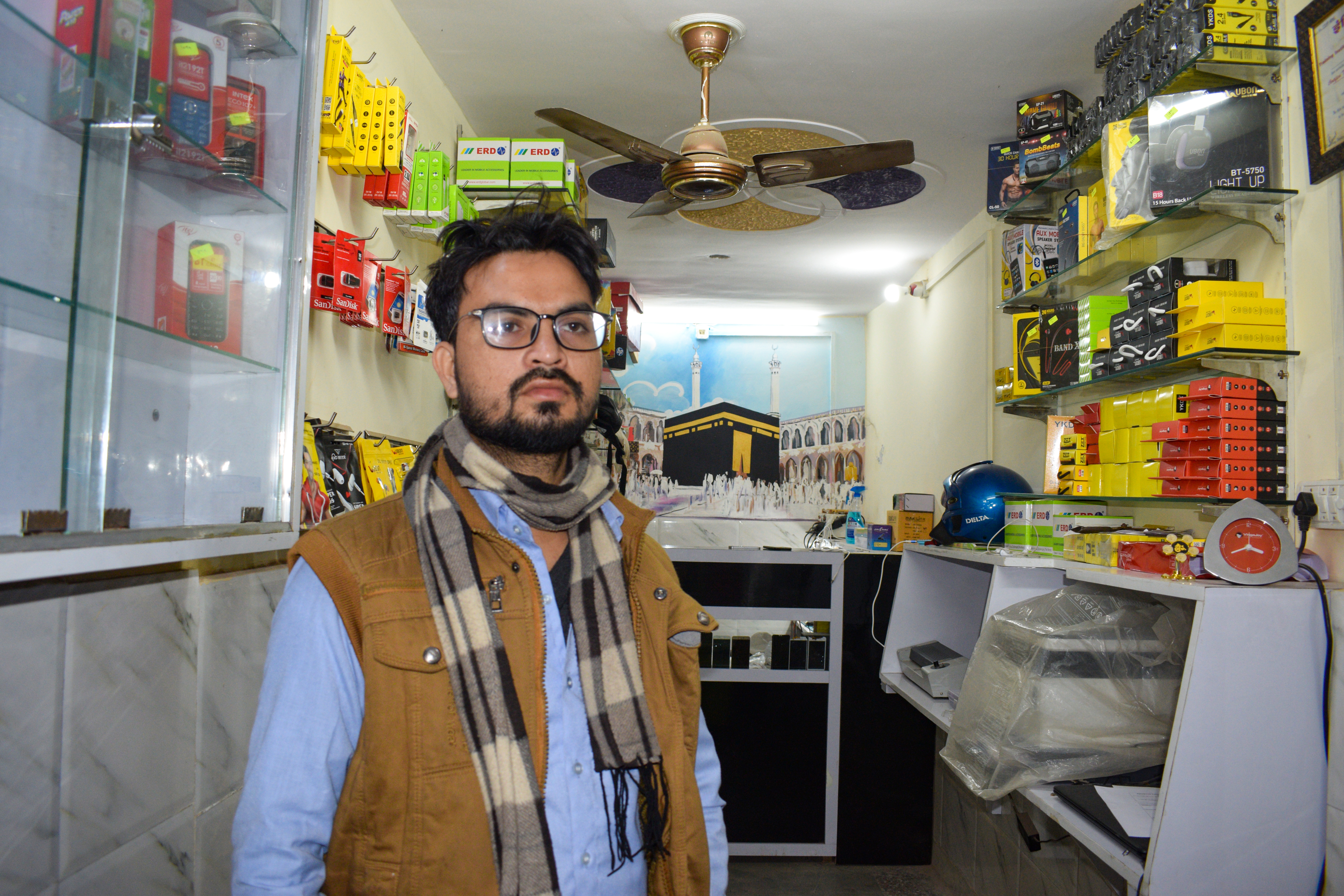 Muhammad's shop was first looted and then burned in last year's violence [Hanan Zaffar and Hasan Akram/Al Jazeera]