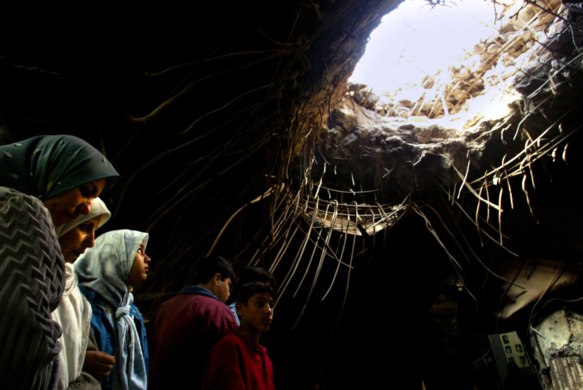 Iraqis visit the Amiriyah Shelter on memorial day, in remembrance of those who died in the American bombing that took place there in 1991 [File: Carolyn Cole/Los Angeles Times via Getty Images]