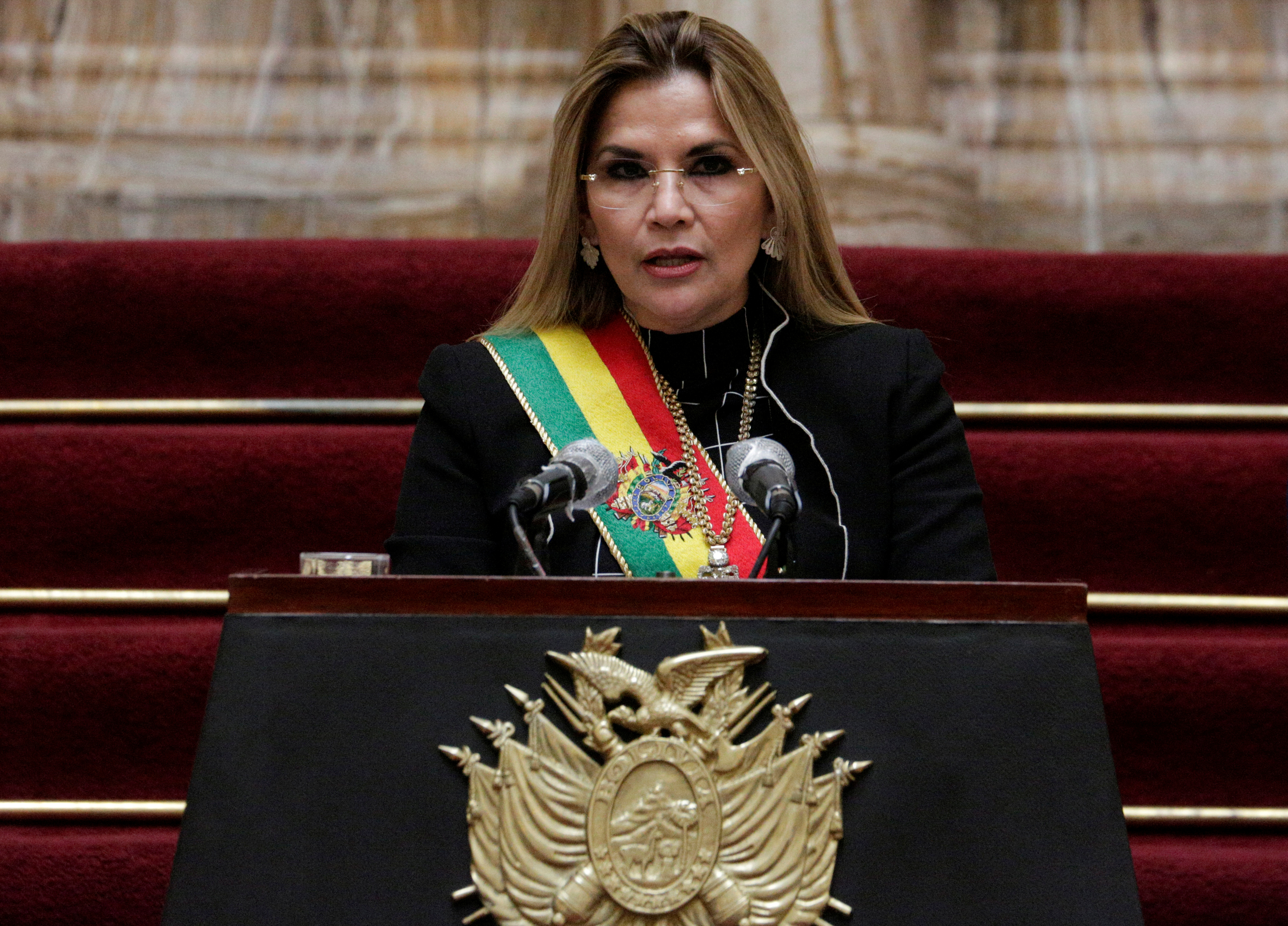Bolivia's former interim President Jeanine Anez shared a link to an arrest warrant, which included her name and several of her former Cabinet and cited allegations of terrorism and sedition [File: David Mercado/Reuters]
