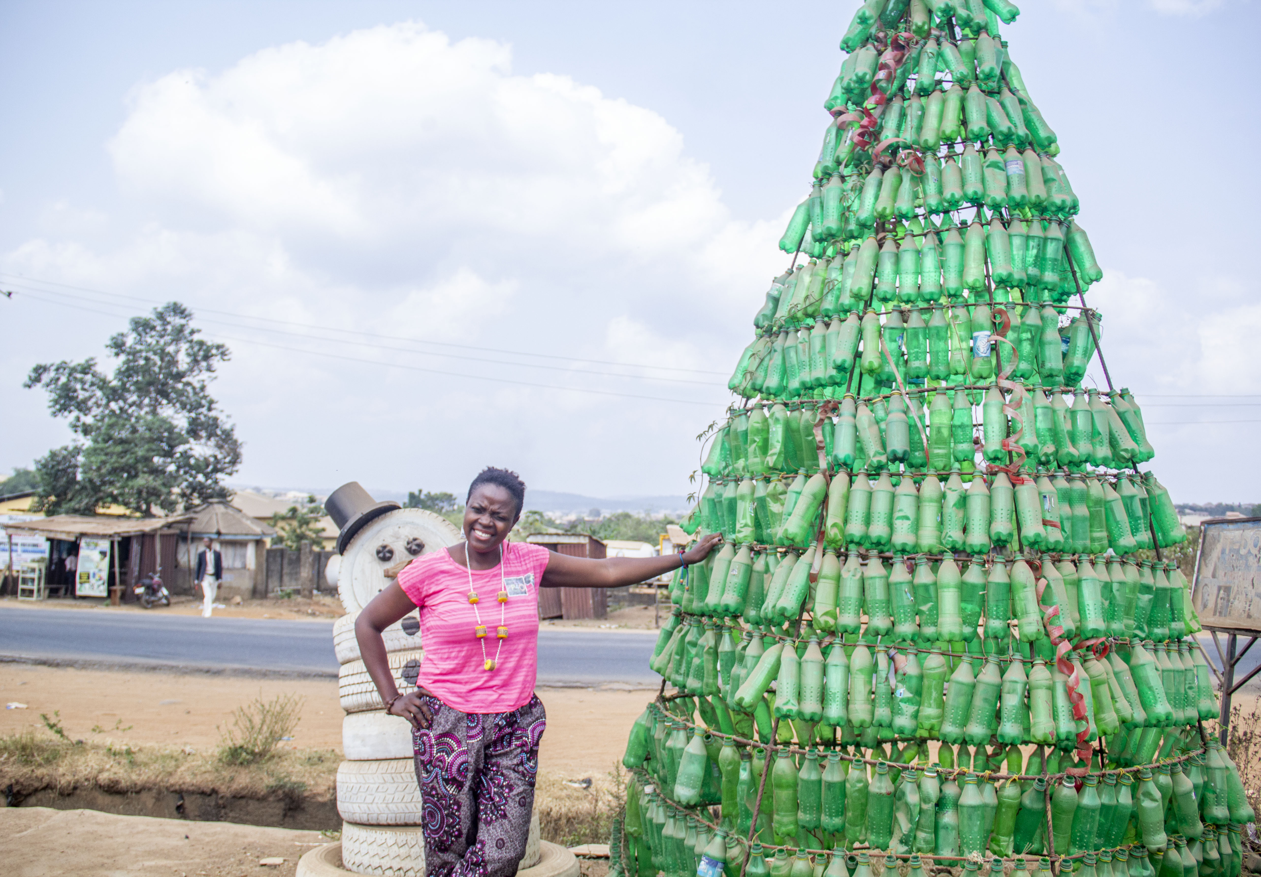 Jumoke Olowokere’s giant Christmas tree, constructed from discarded bottles, has become a permanent fixture on the street near her office in Ibadan [Femi Amogunla/Al Jazeera]