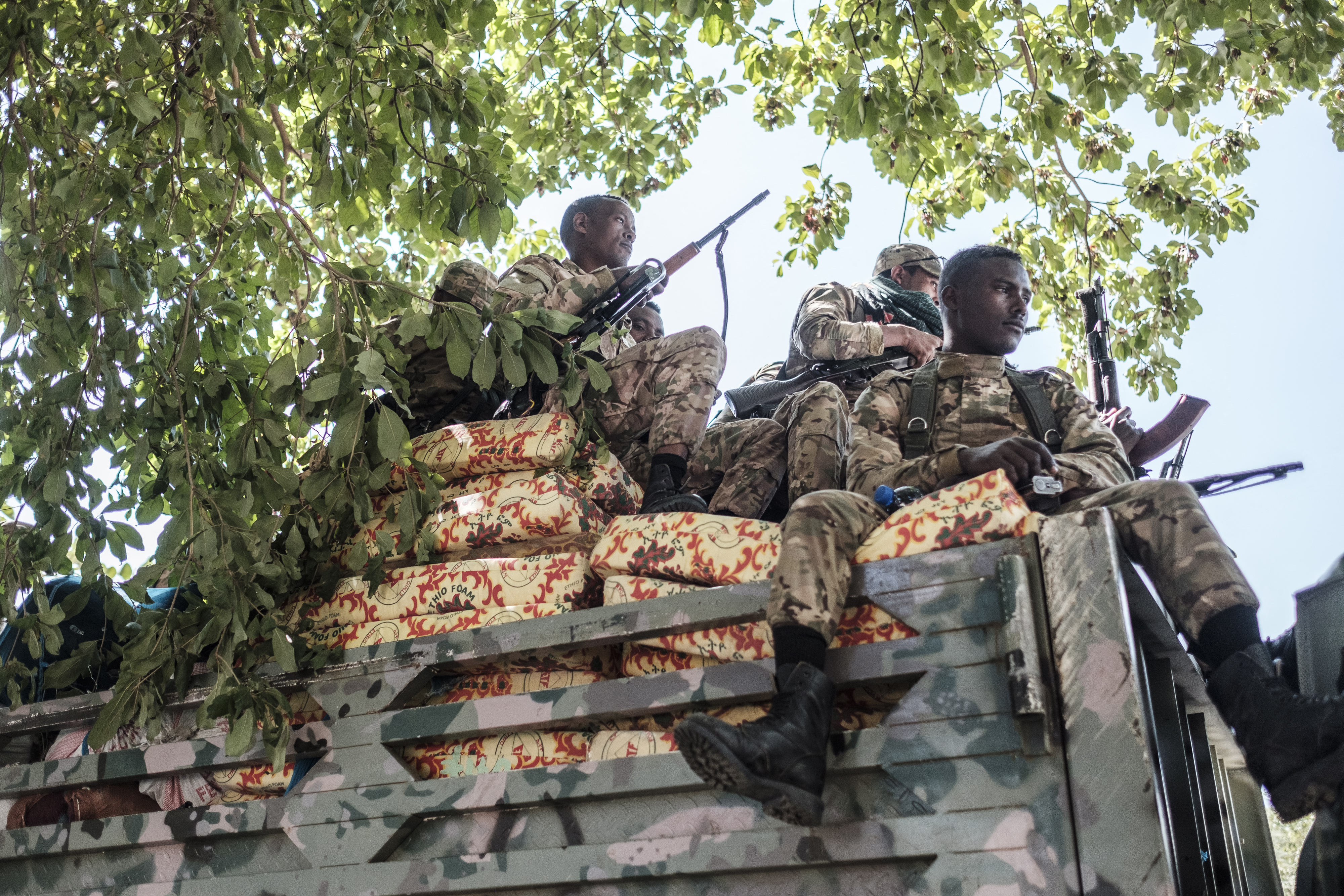Members of the Amhara Special Forces sit on a truck in Alamata, Ethiopia, on December 11, 2020 [Eduardo Soteras/ AFP]