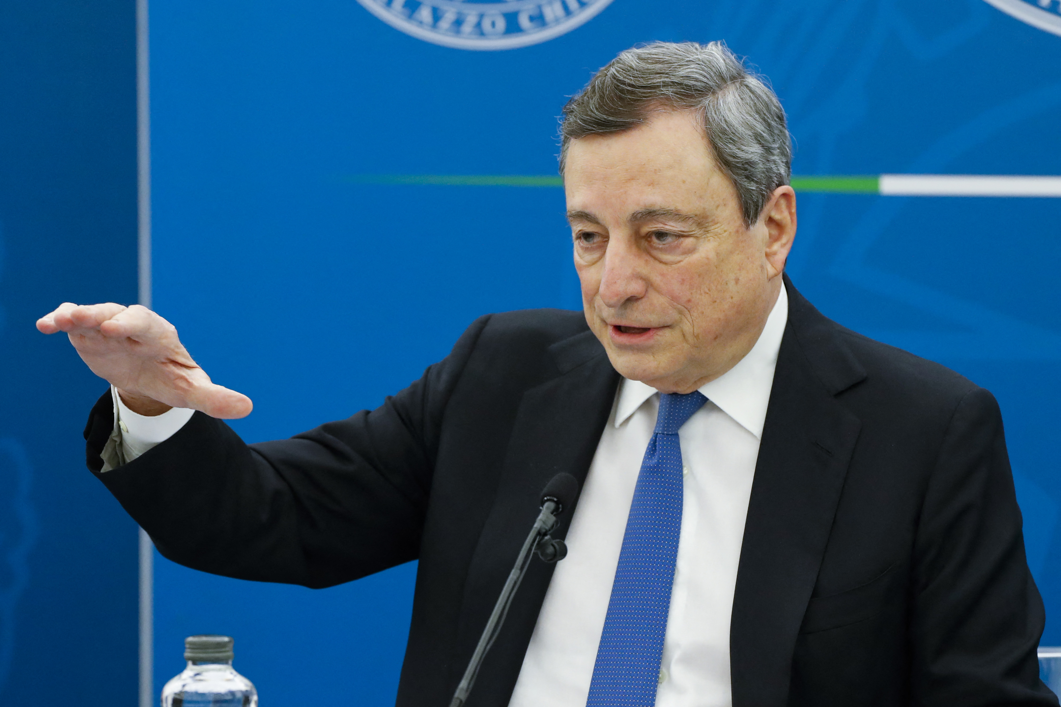 Mario Draghi speaks at a press conference