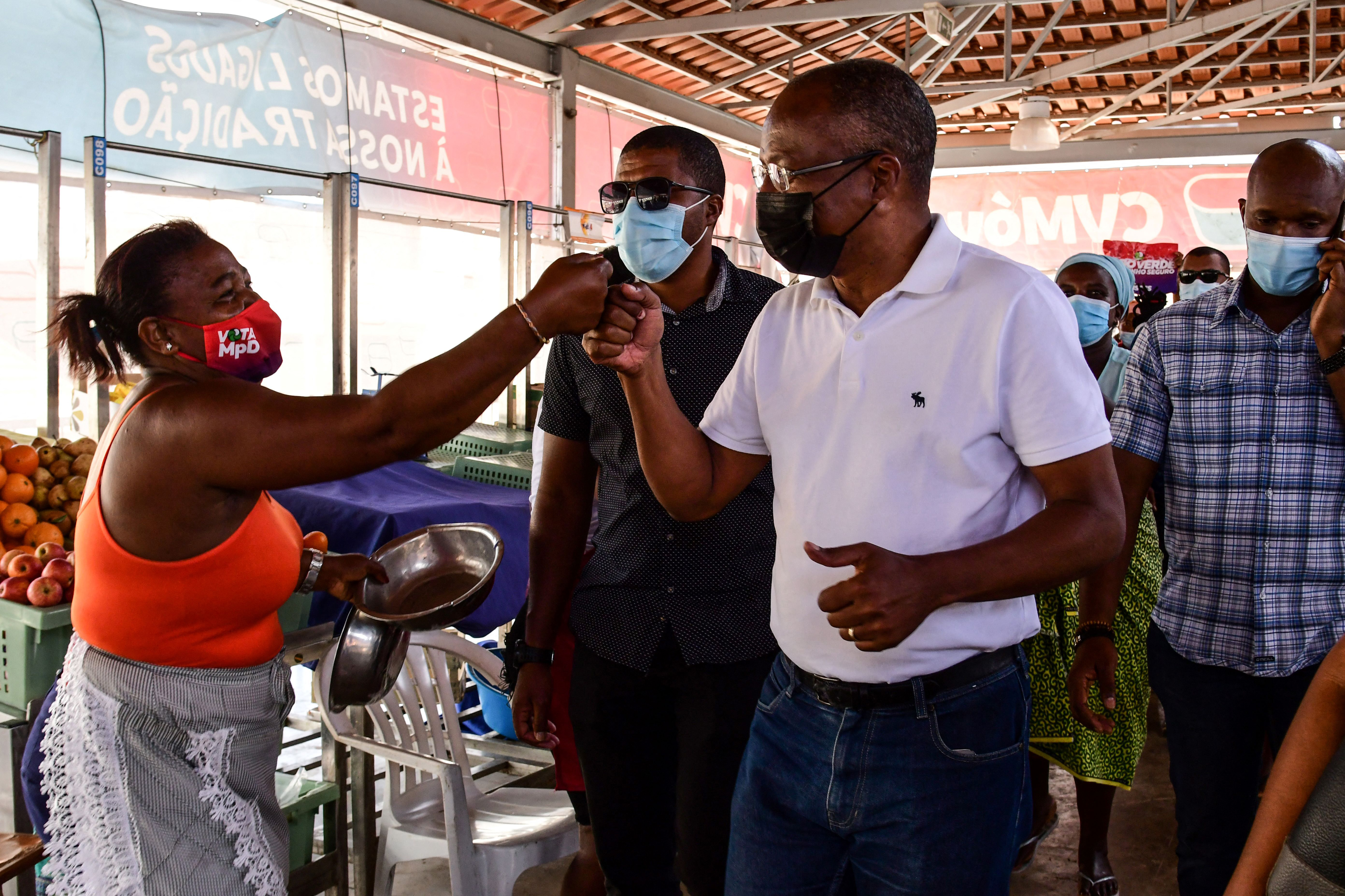 Prime Minister of Cape Verde Ulisses Correia e Silva interacts with vendors at the Plateau market in Praia, after his victory in the 2021 parliamentary elections [Seyllou/AFP]