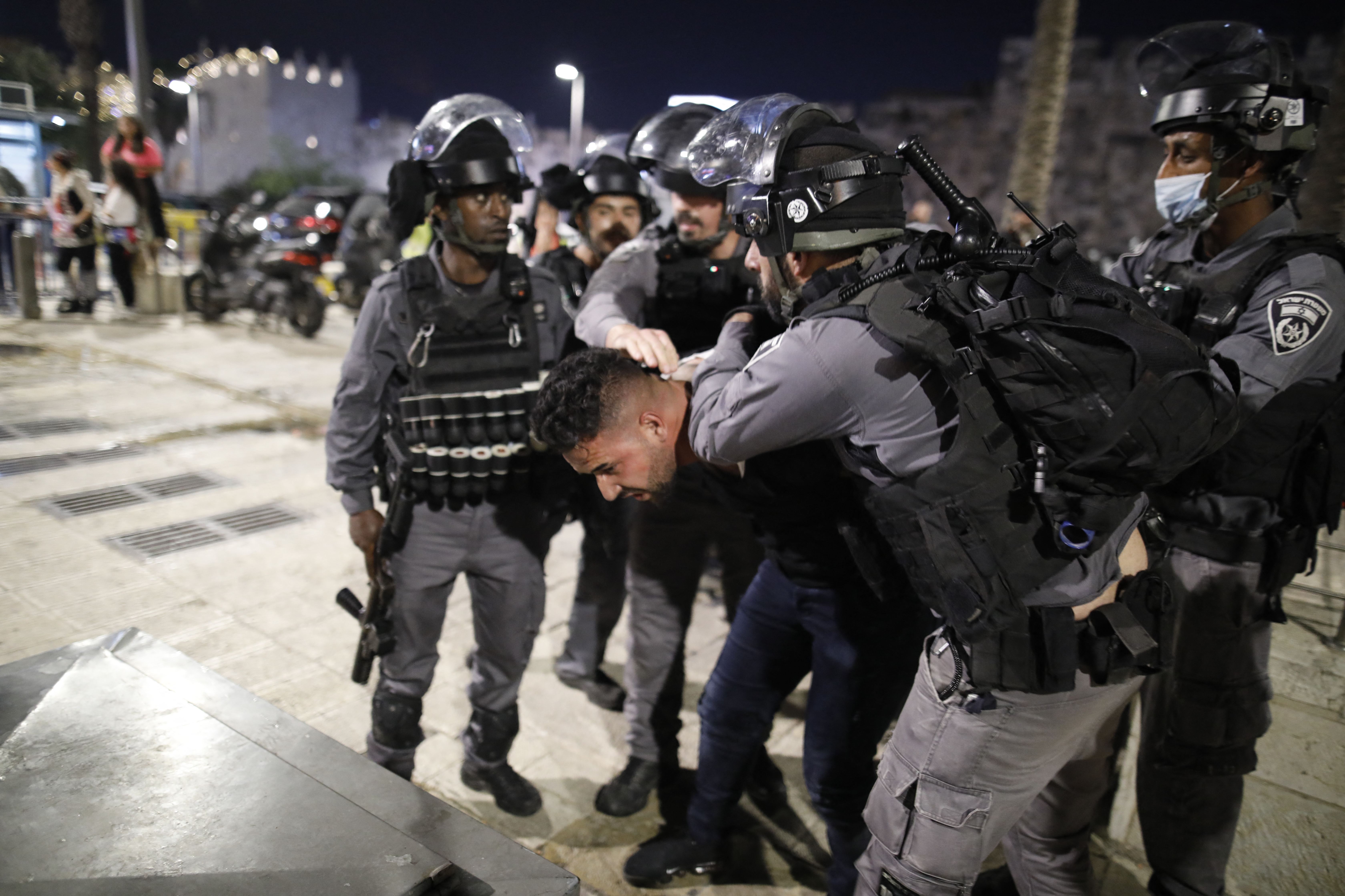 Armed Israeli police detain a Palestinian protester in Jerusalem’s Old City