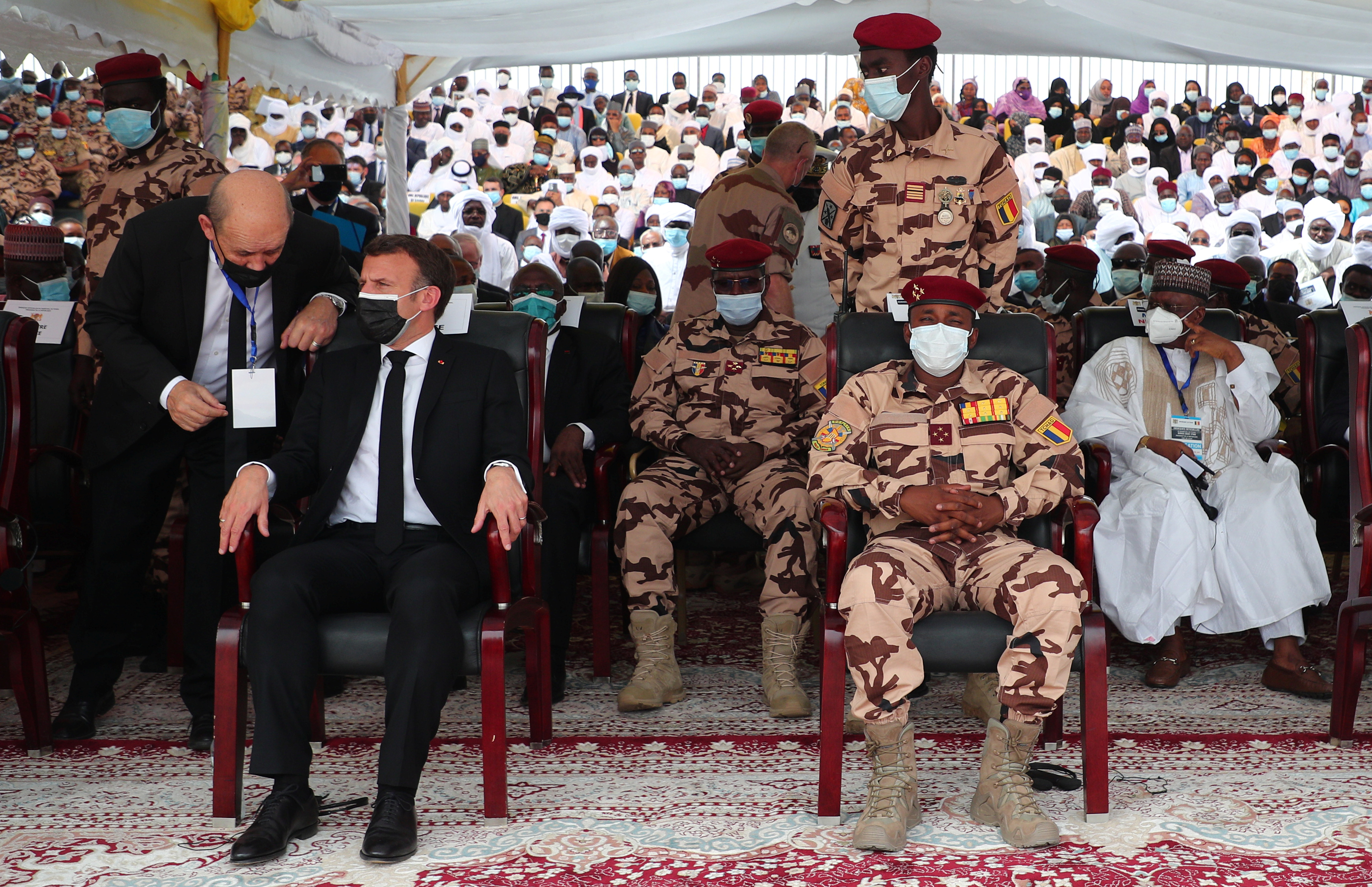 French President Emmanuel Macron sits in the front row next to Mahamat Idriss Deby, head of Chad's transitional military council