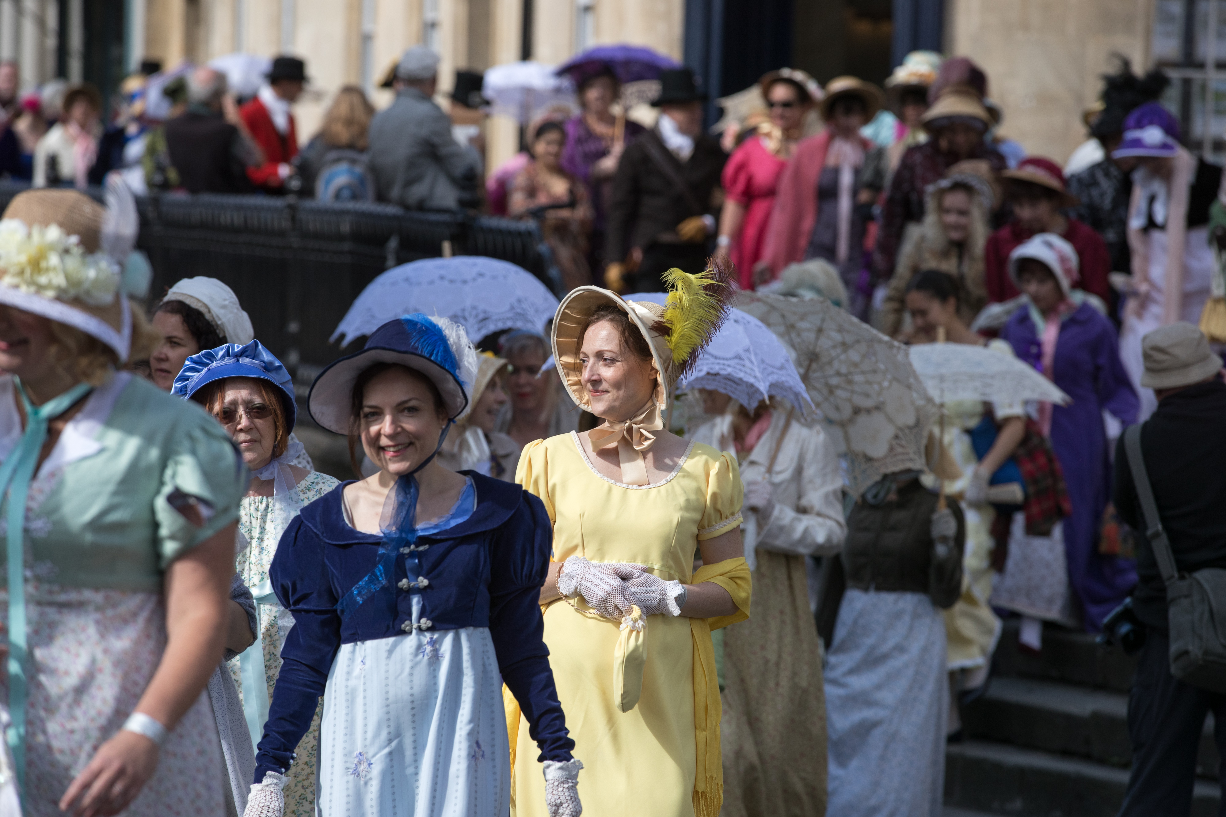 Participants in the annual Jane Austen Regency Costumed Parade walk through the centre of Bath in England on September 9, 2017 [File: Matt Cardy/Getty Images]