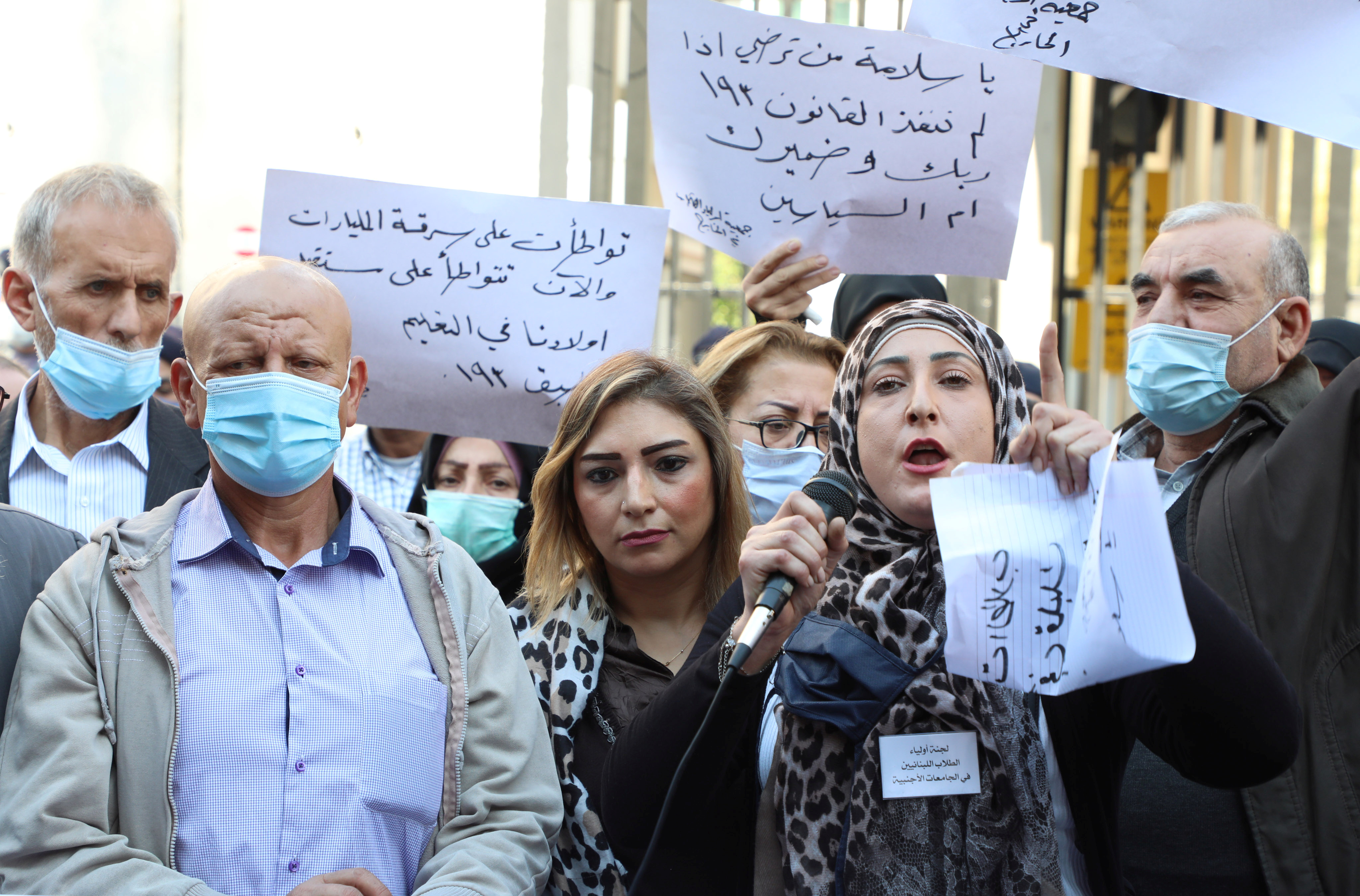 Parents of students abroad protest against the economic crisis in front of Lebanon's central bank in Beirut in November 2020 [Mohamed Azakir/Reuters]