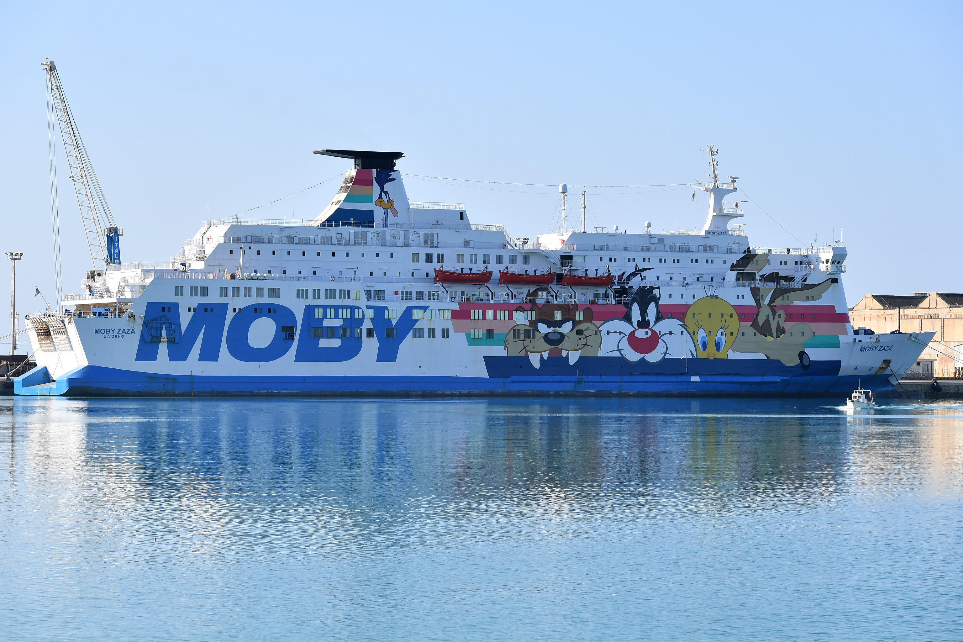 The quarantine ship Moby Zaza with migrants on board who have been quarantined and are waiting to disembark, moors in the port of Porto Empedocle, Sicily, Italy, on July 6, 2020. Some 180 migrants rescued in international waters arrived on board the Ocean Viking to be transferred onto the Moby Zaza [Carmelo Imbesi/EPA-EFE]
