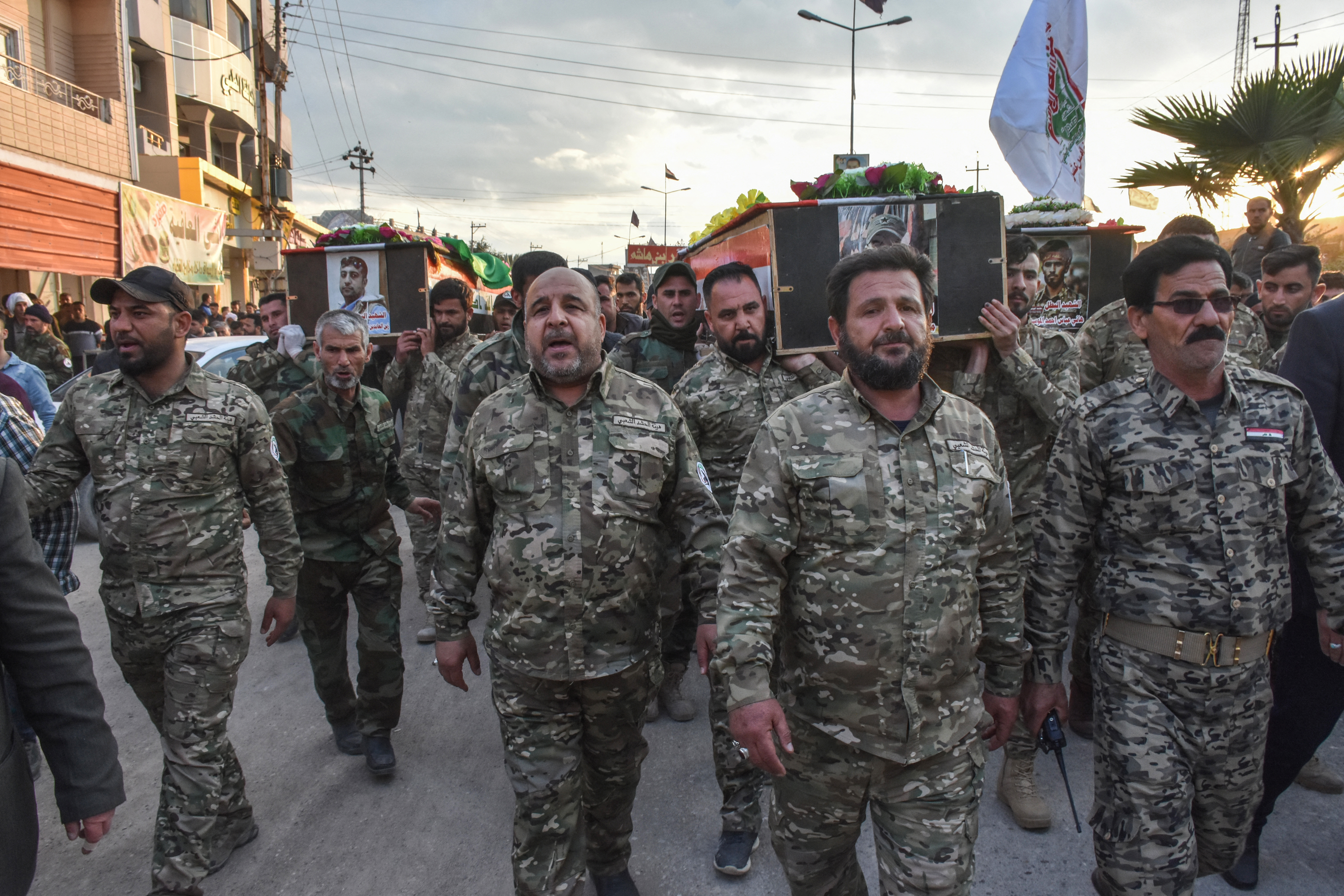 Fighters of the Hashed al-Shaabi paramilitary forces carry the coffins of fellow fighters, who were killed in an ambush on a desolated road south of Mosul, during a funeral in their hometown in the northern Iraqi town of Tuz Khurmatu near the city of Kirkuk, on March 7, 2019 [File: AFP/Marwan Ibrahim]