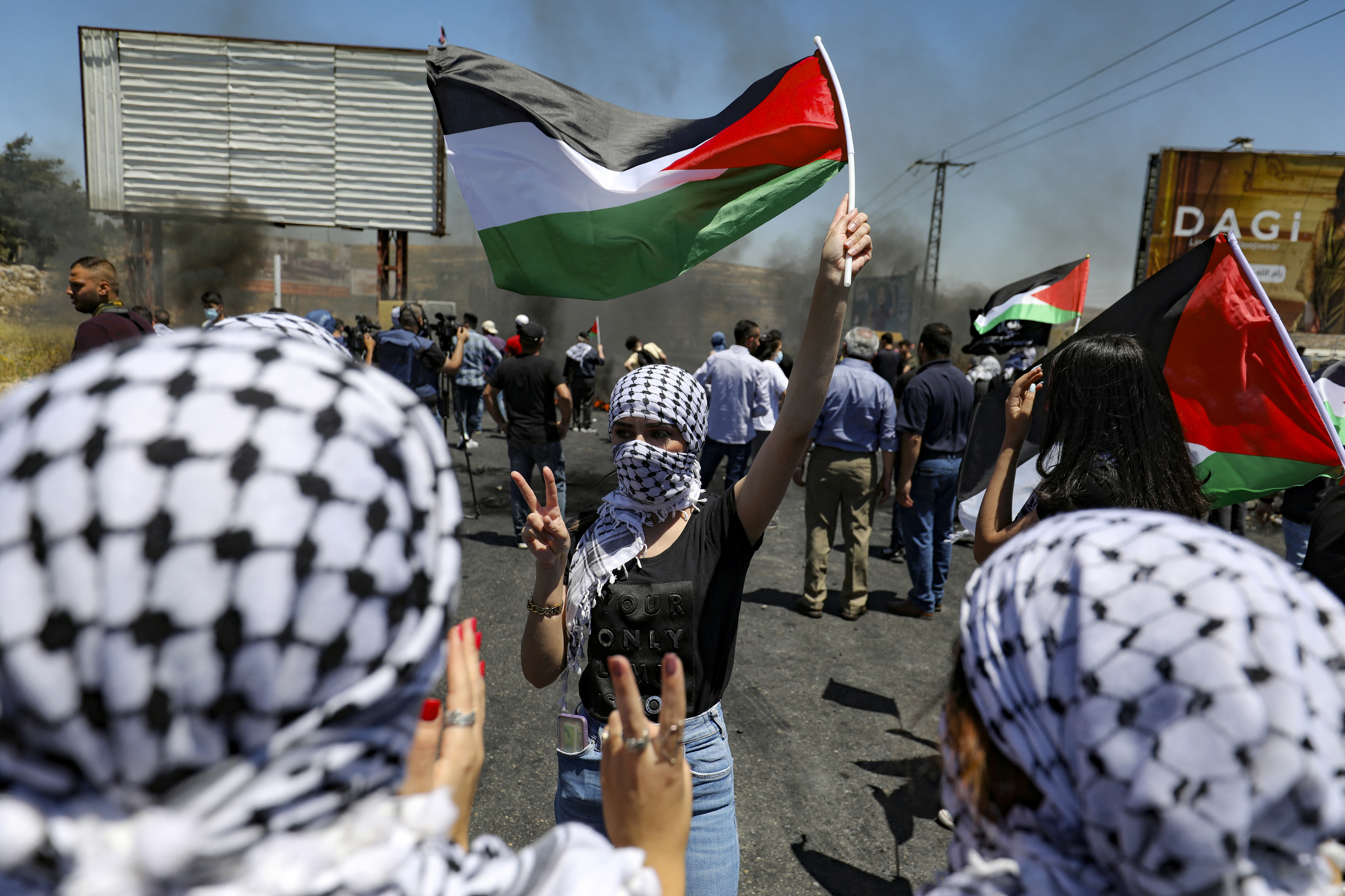 Young Palestinian women take part in a protest near the illegal Jewish settlement of Beit El, near Ramallah in the occupied West Bank [Abbas Momani/AFP]