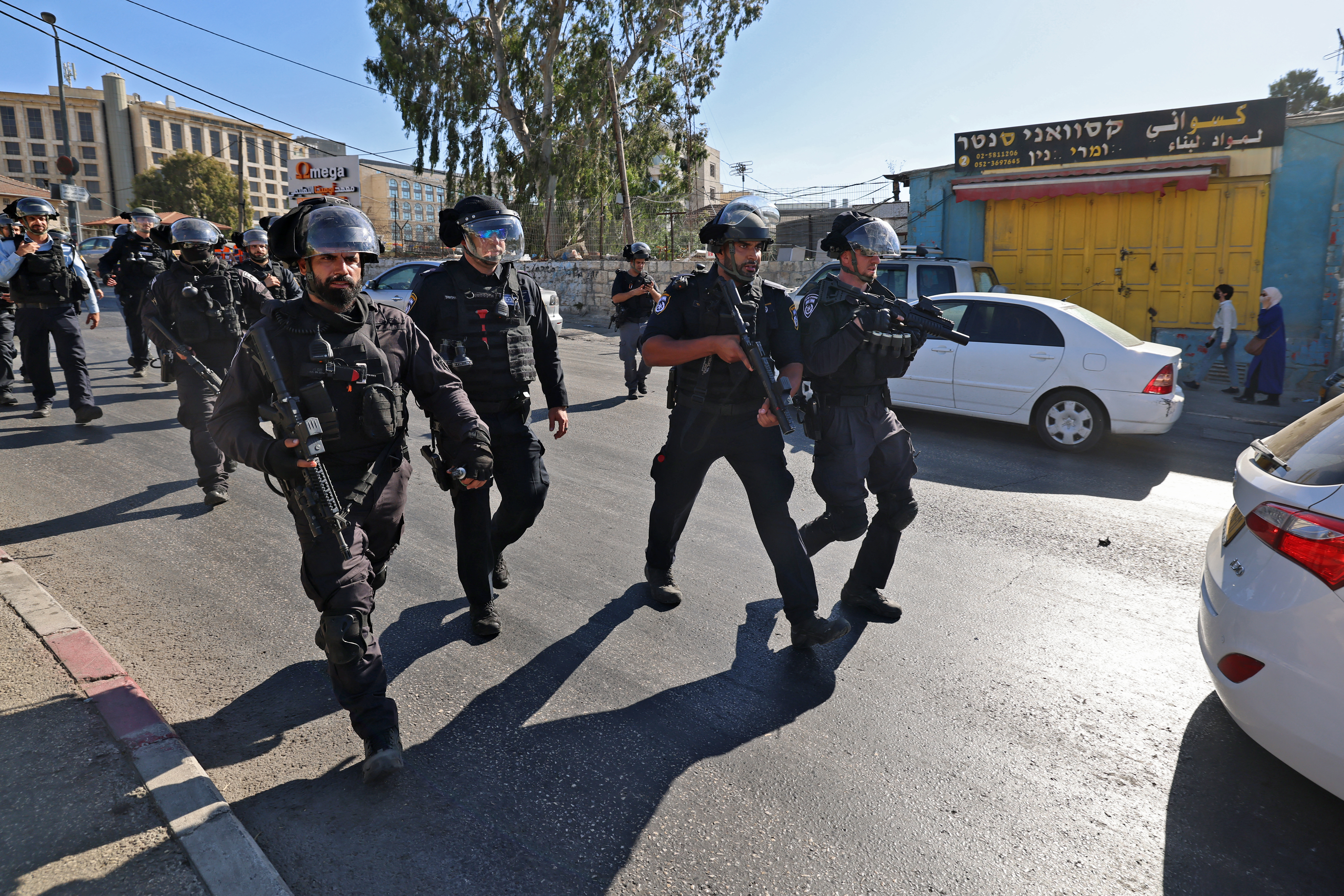 Israeli security forces advance towards Palestinian demonstrators during protests at the flashpoint Sheikh Jarrah neighbourhood in occupied East Jerusalem [Emmanuel Dunand/AFP]