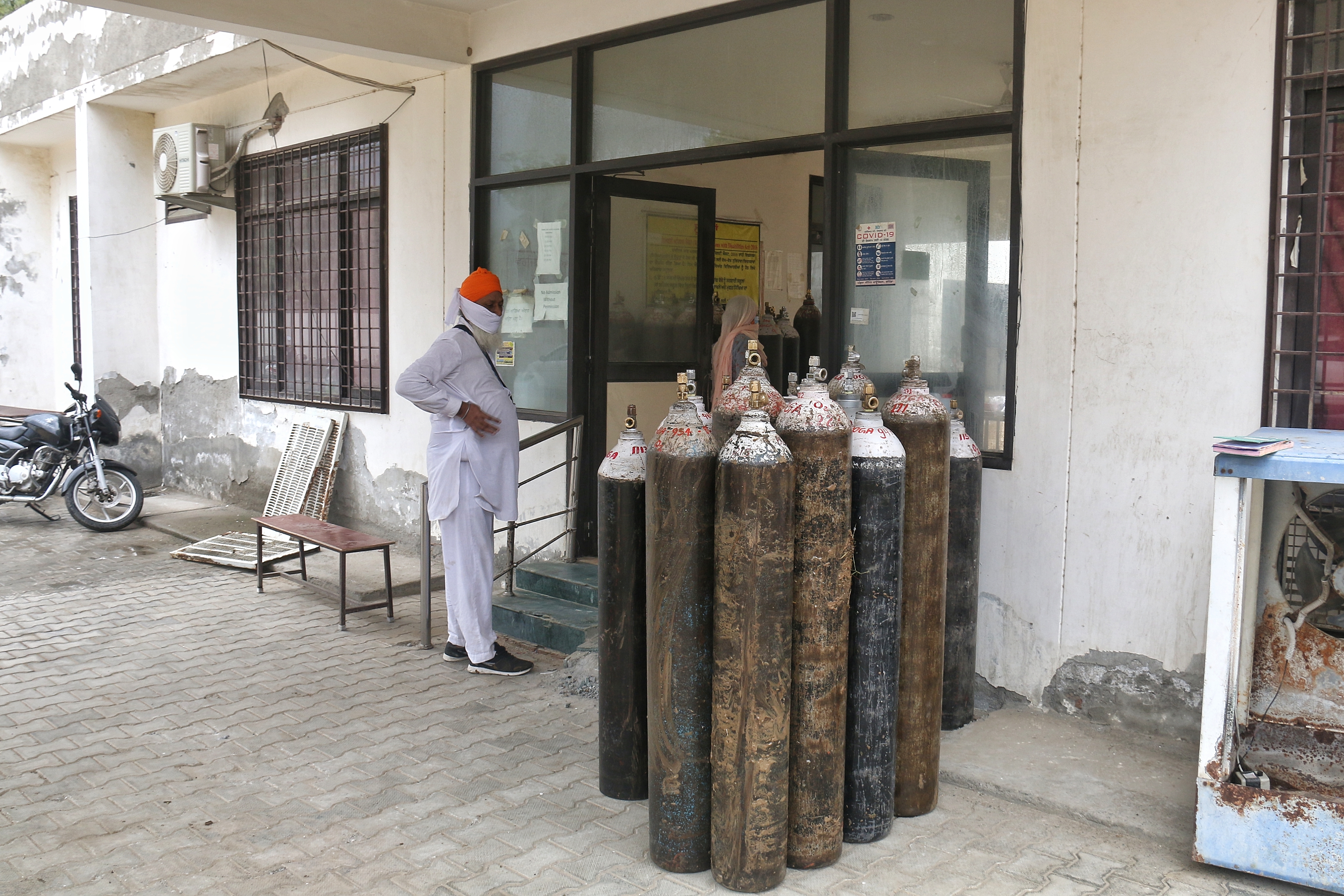 Empty oxygen cylinders kept at a local health facility in Bhatinda, Punjab [Lalita Verma/Al Jazeera]