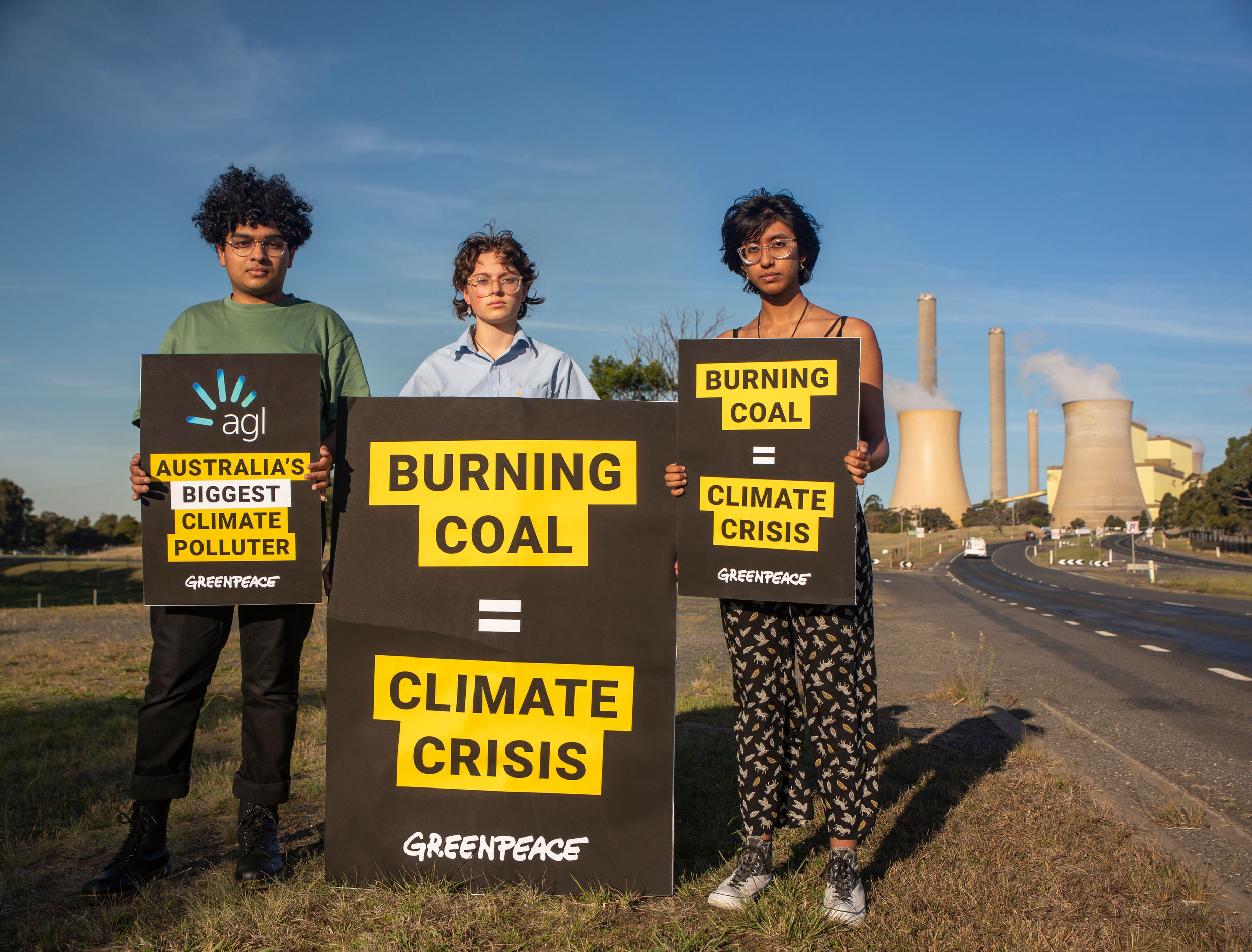 Three Victorian school strikers protest AGL Energy’s burning of coal at their Loy Yang coal-fired power station. Greenpeace says AGL Energy is Australia’s single biggest climate polluter [Courtesy of Dale Cochrane/Greenpeace]