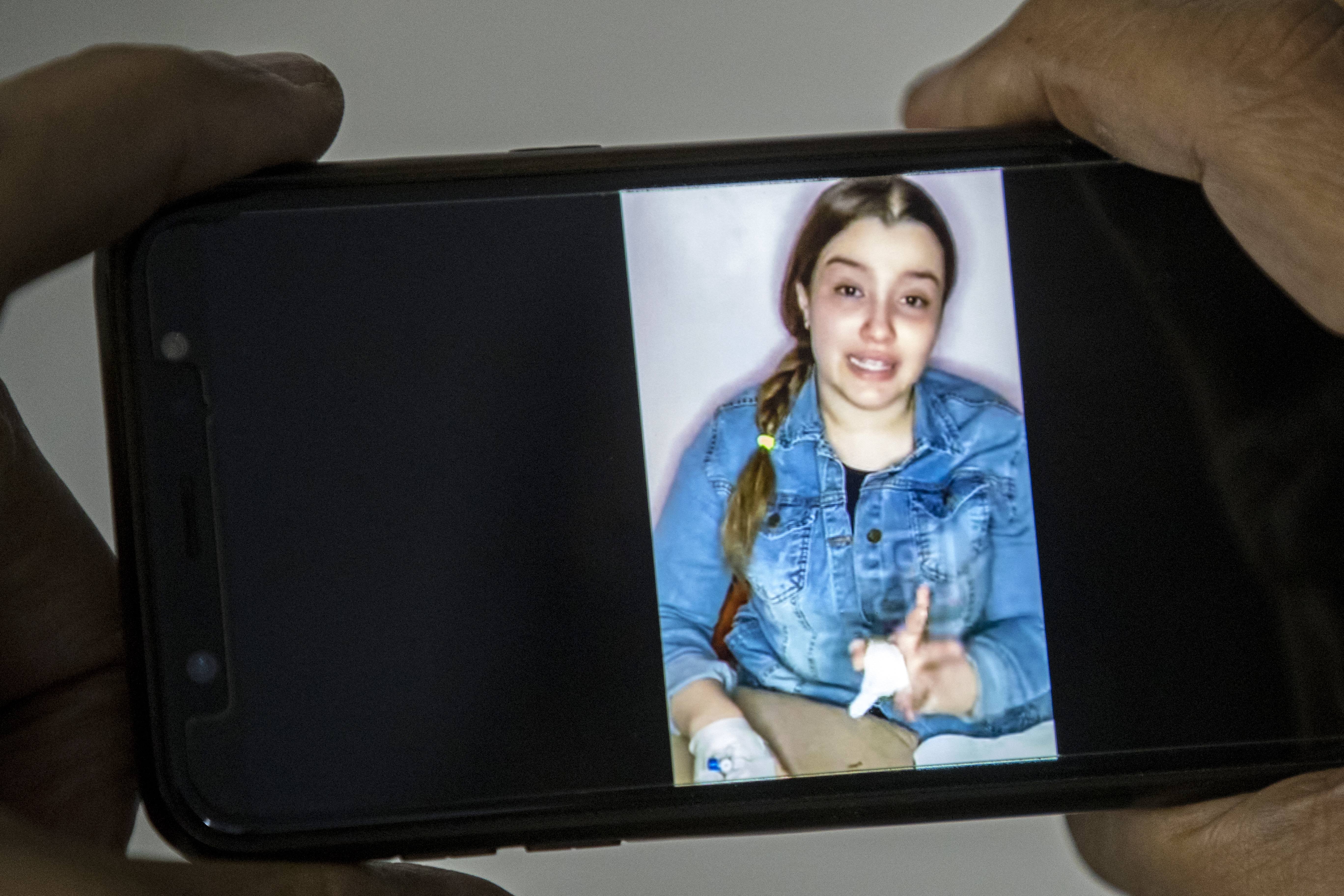 A man watches a video posted by Egyptian Tiktok influencer Haneen Hossam