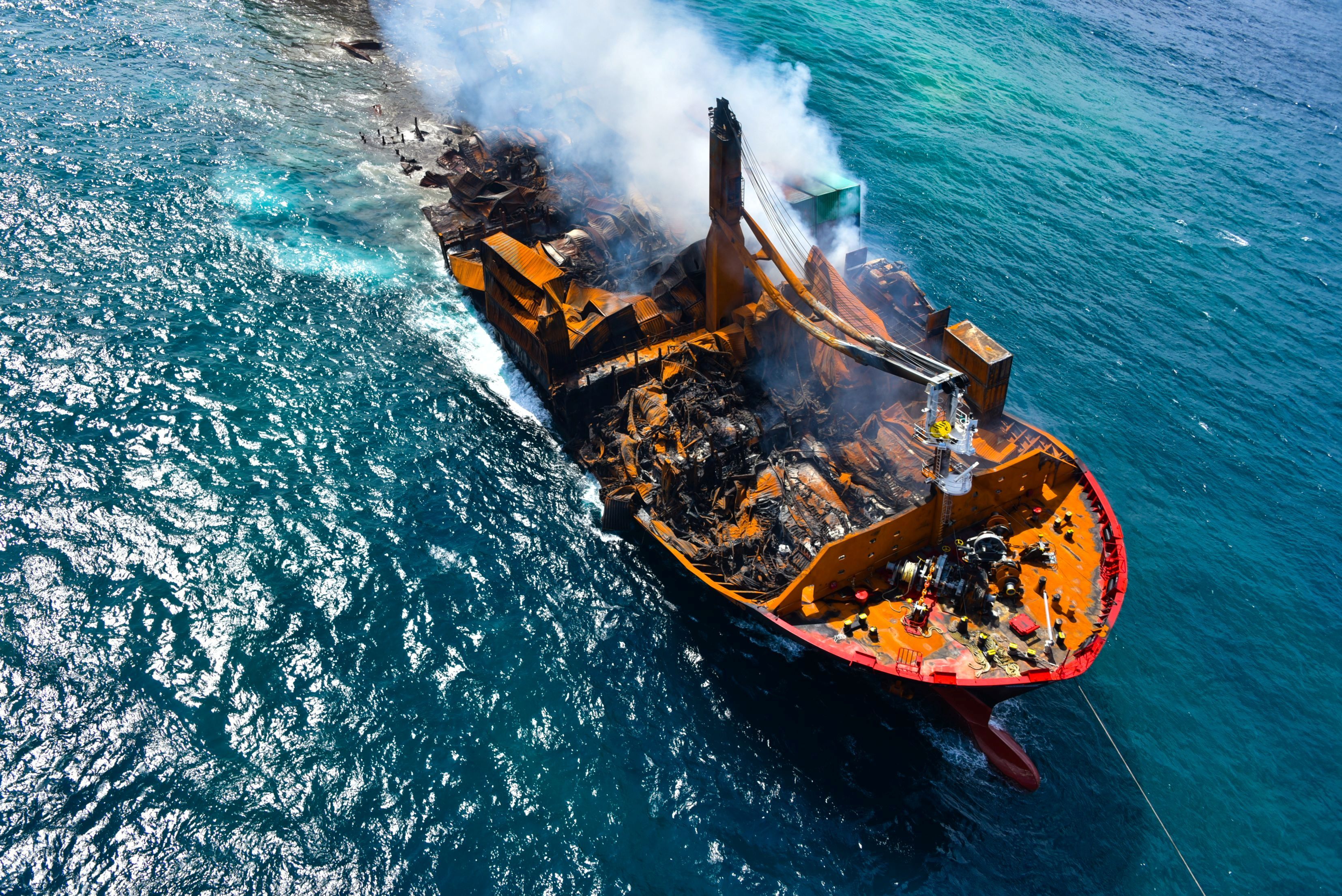 Smoke rises from a fire onboard the MV X-Press Pearl vessel as it sinks while being towed