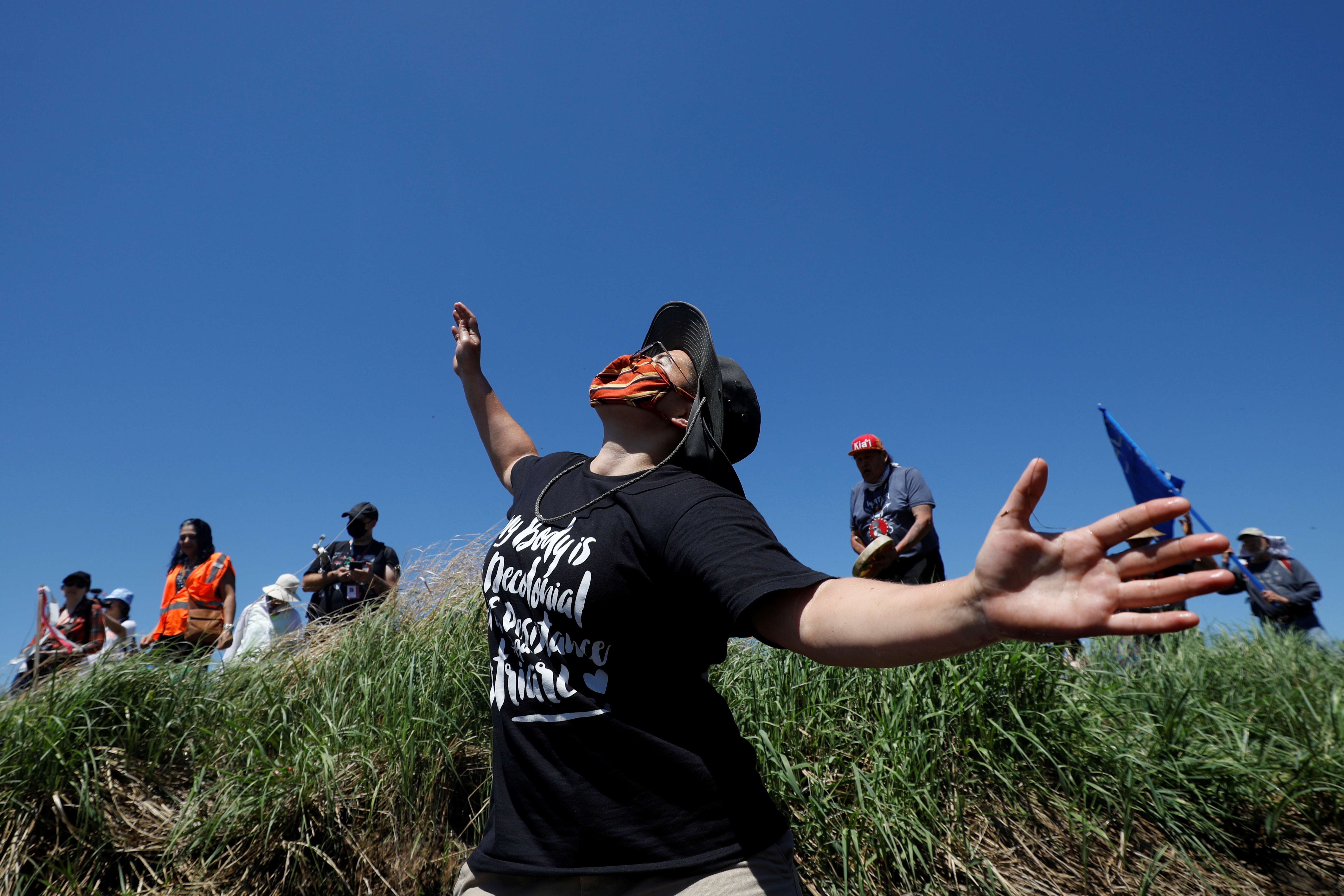 Indigenous leaders and activists participate in prayer at the Mississippi headwaters during a protest against the Line 3 pipeline, in Solway, Minnesota