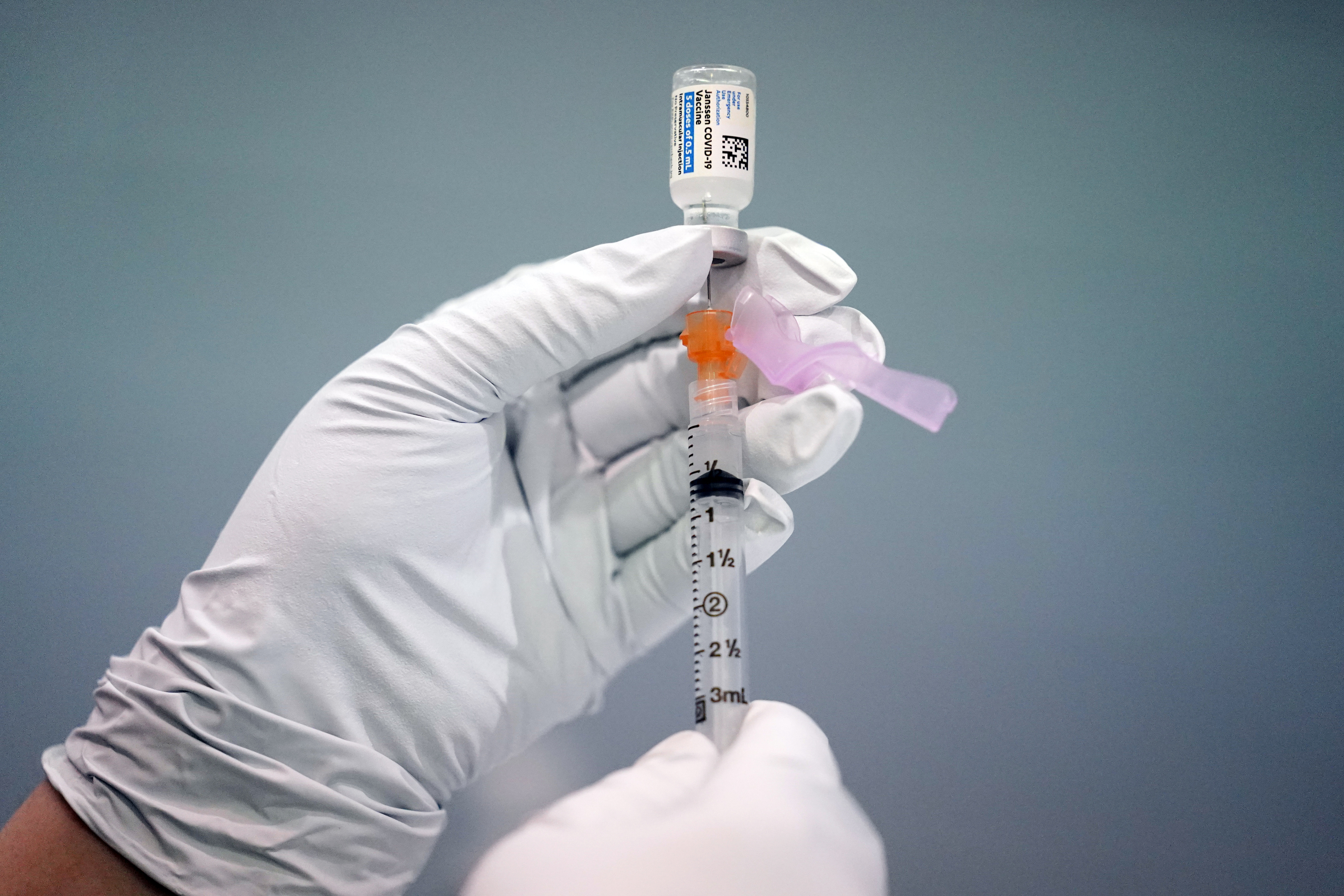 A waiver proposal for COVID-19 vaccine patents has been put forward by 64 members of the WTO [File: Matt Rourke/AP Photo]