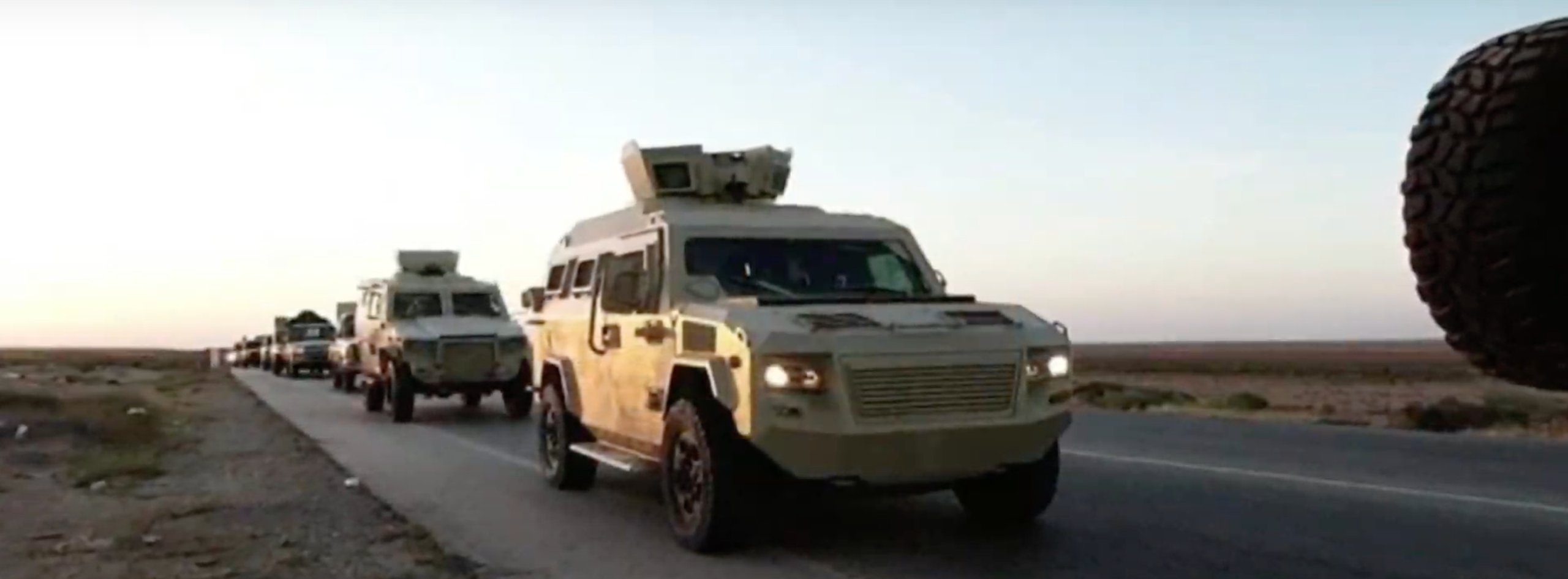Haftar's forces published pictures of their armoured vehicles positioned in and around the border crossing [Screengrab/Al Jazeera via Haftar Media]