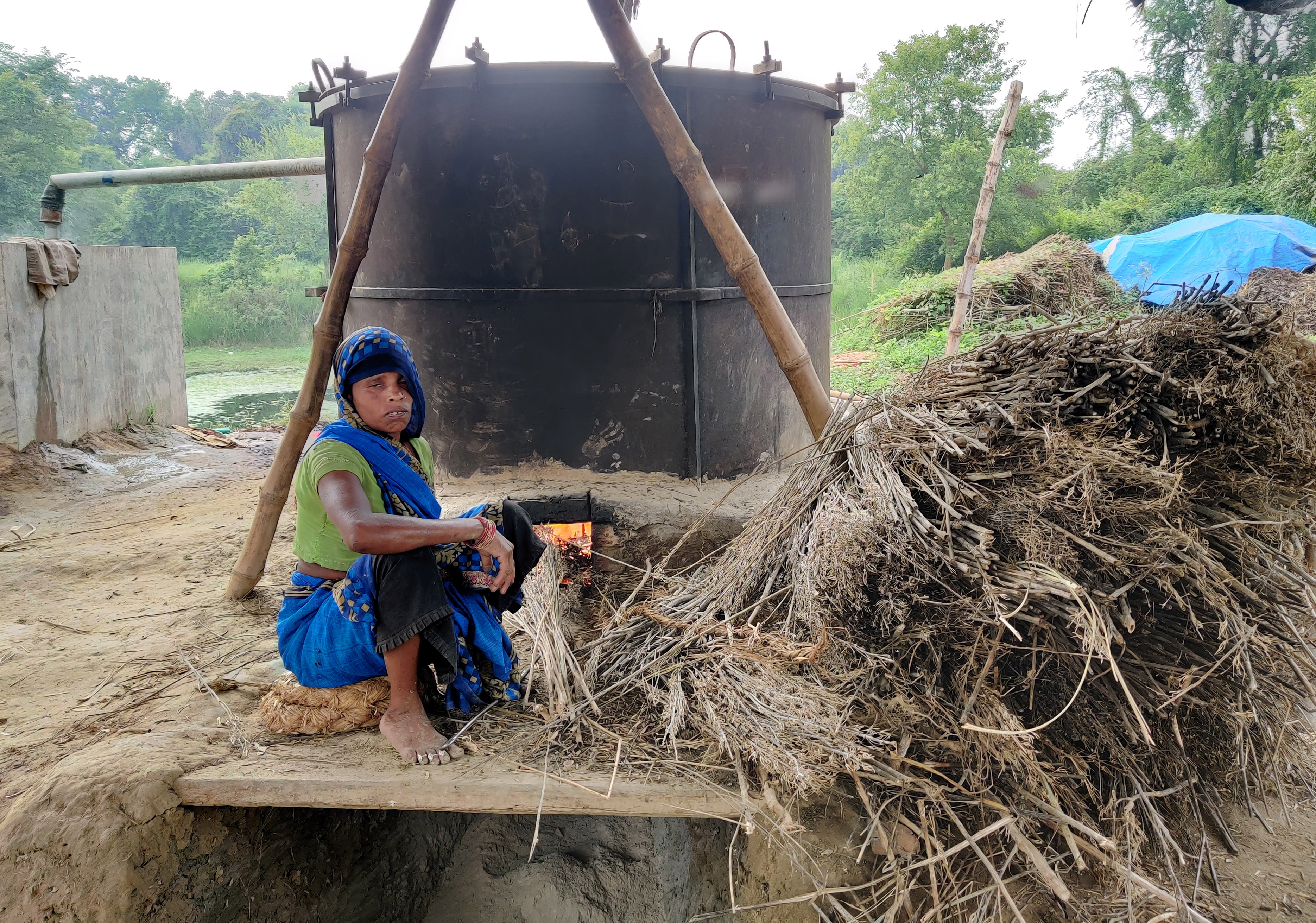 Manorami Rawat, 35, works at a furnace to extract peppermint oil in Dalipur village in the northern state of Uttar Pradesh