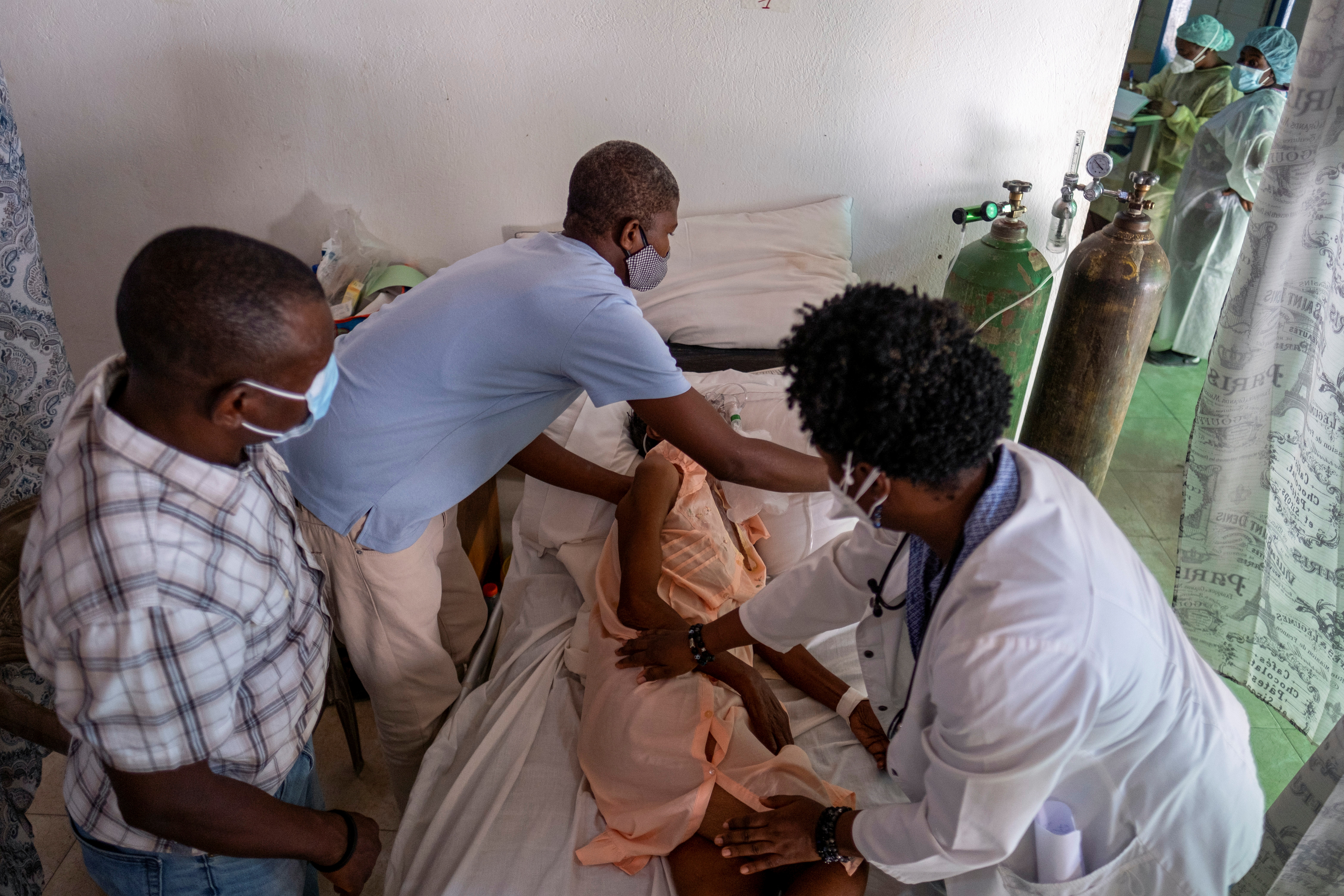 A patient suffering from the coronavirus disease (COVID-19) receives treatment at the St. Luke Foundation for Haiti Hospital, in Port-au-Prince, Haiti July 16, 2021