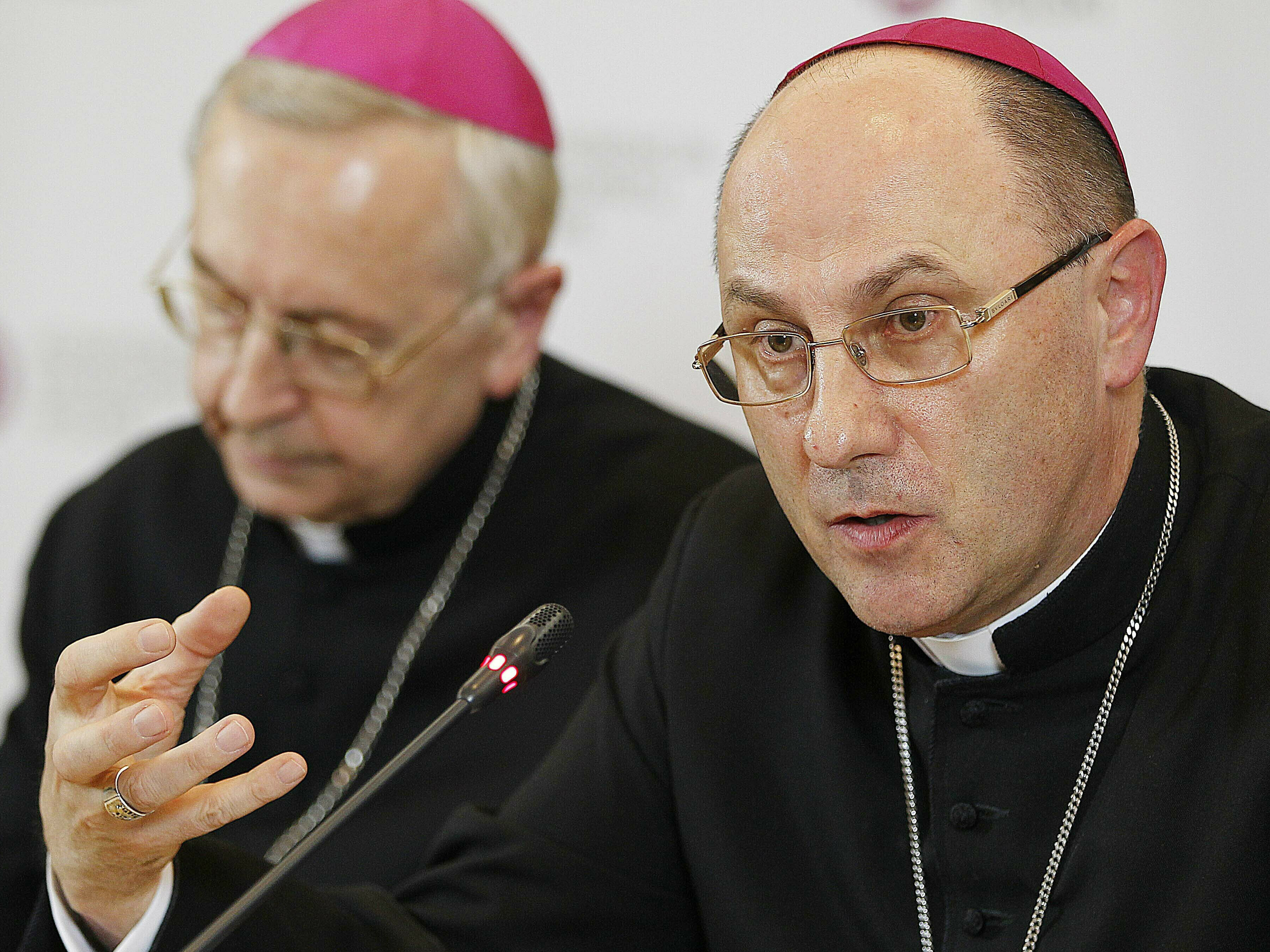 The head of Poland's Catholic Church Archbishop Wojciech Polak, right, addresses the media during a news conference in Warsaw, Poland in March 2019. Archbishop Wojciech Polak apologised to survivors of sexual abuse at the hands of Catholic Church clergy and asked for forgiveness [File: Czarek Sokolowski/AP Photo]
