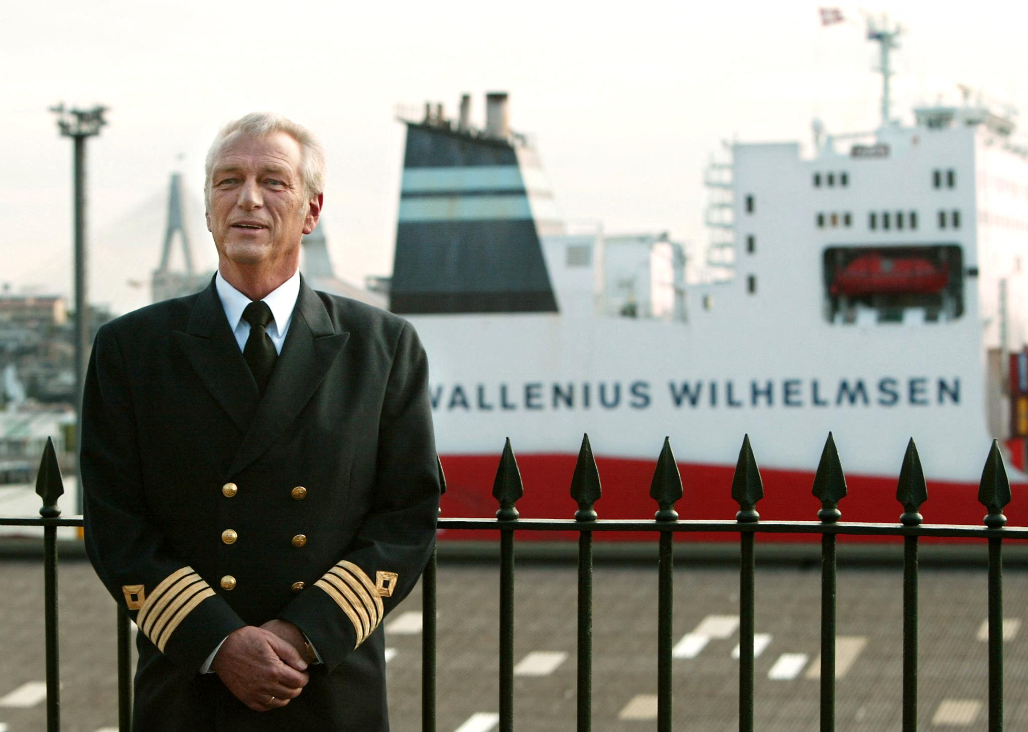 Captain Arne Rinnan of the Norwegian container ship MV Tampa (background) visits the historic Rocks area of Sydney, 13 May 2002, where he answered questions about his rescue of 438 refugees off the coast of Christmas Island on 26 August 2001 [Torsten Blackwood/AFP]